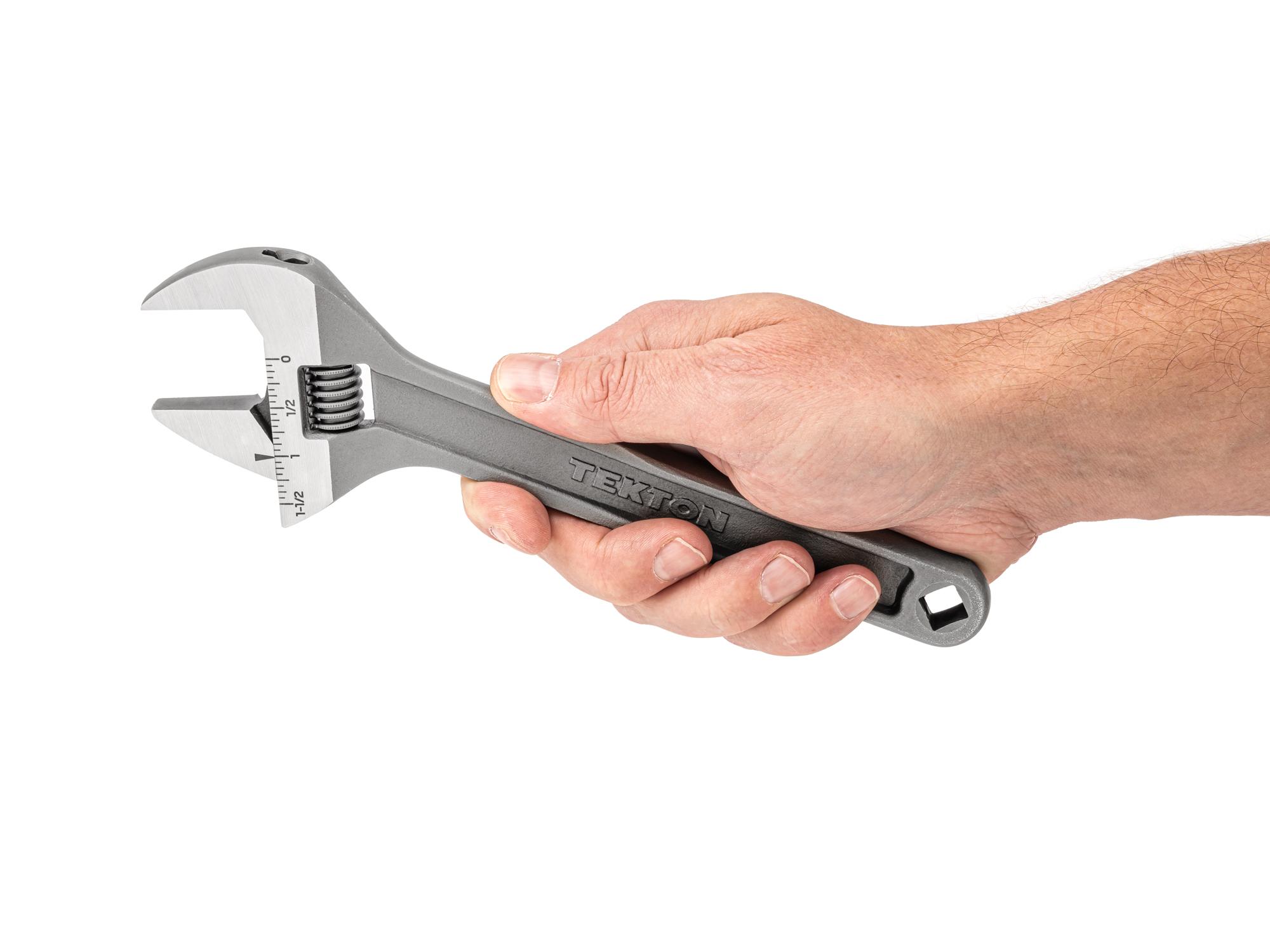 Person holding Tekton 9 inch adjustable wrench. Item #WSA04222