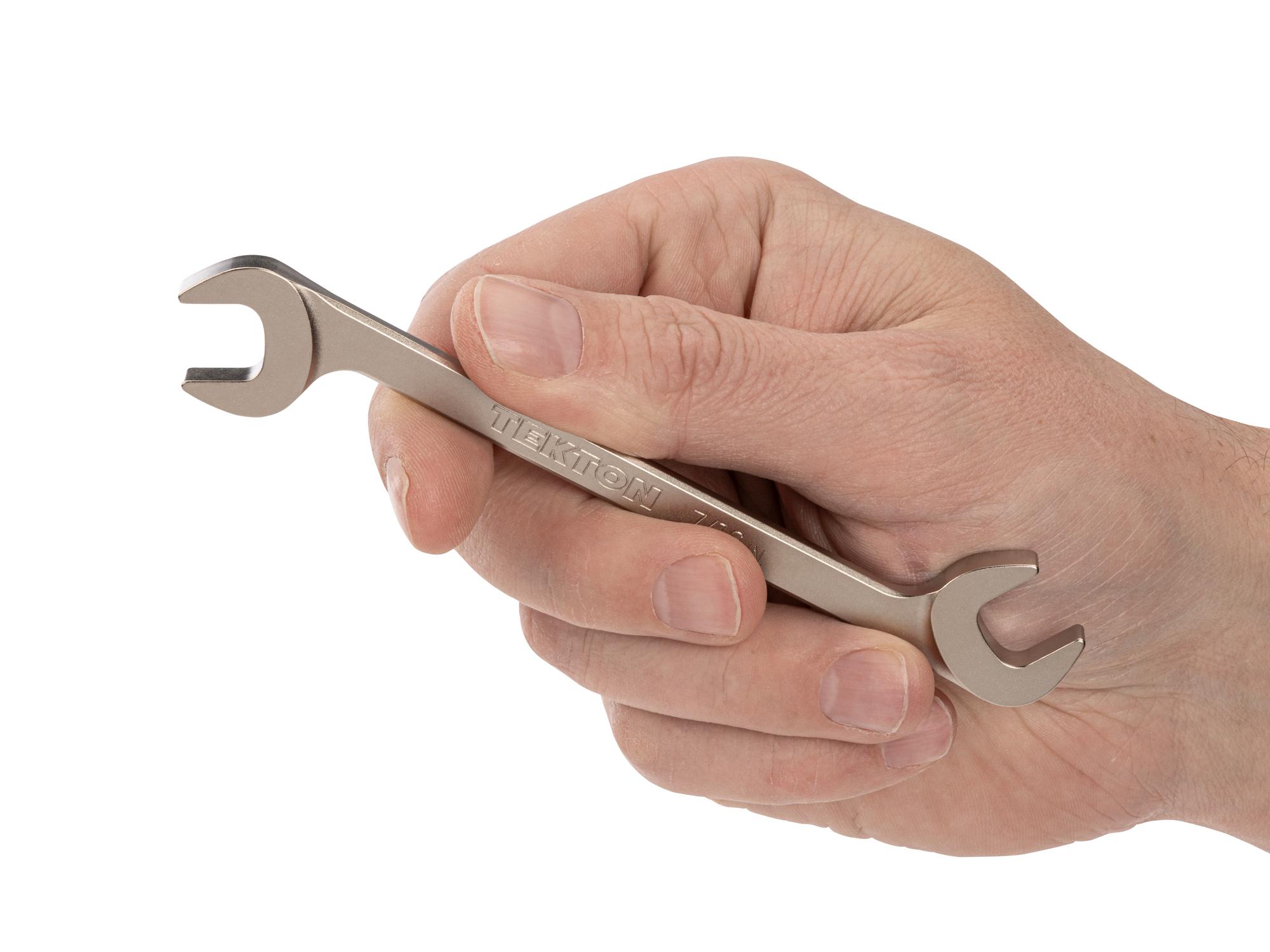 Person holding Tekton angle head wrench. Item #WAE83211