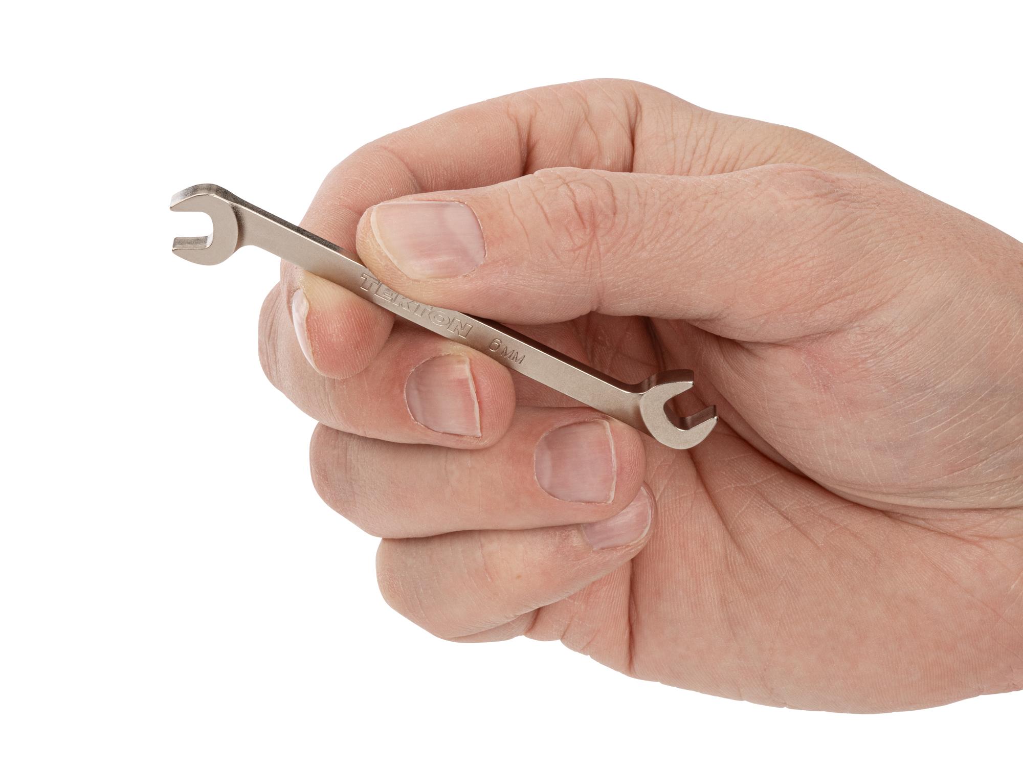 Person holding Tekton angle head wrench. Item #WAE84206