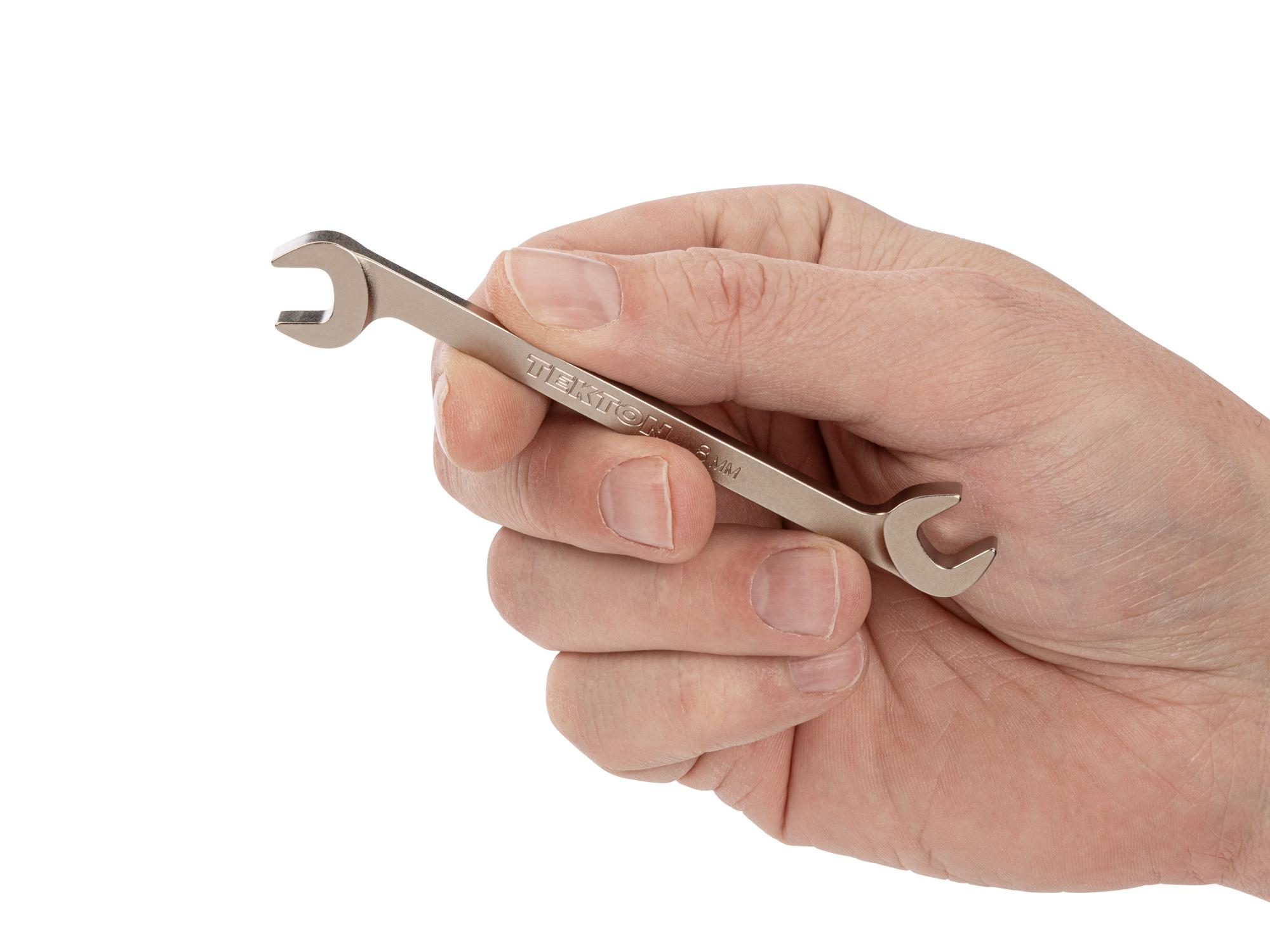 Person holding Tekton angle head wrench. Item #WAE84208