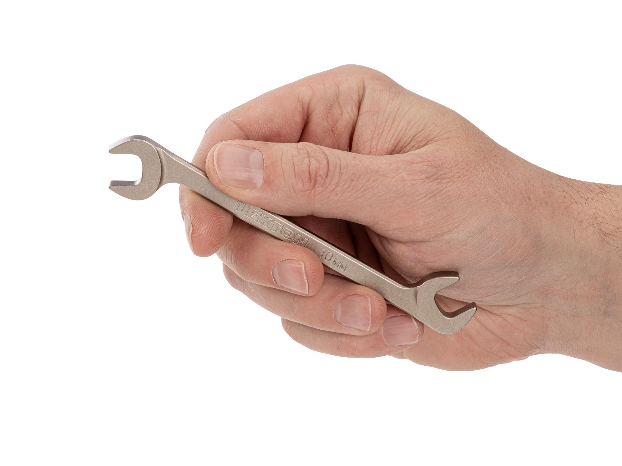 Person holding Tekton angle head wrench. Item #WAE84210