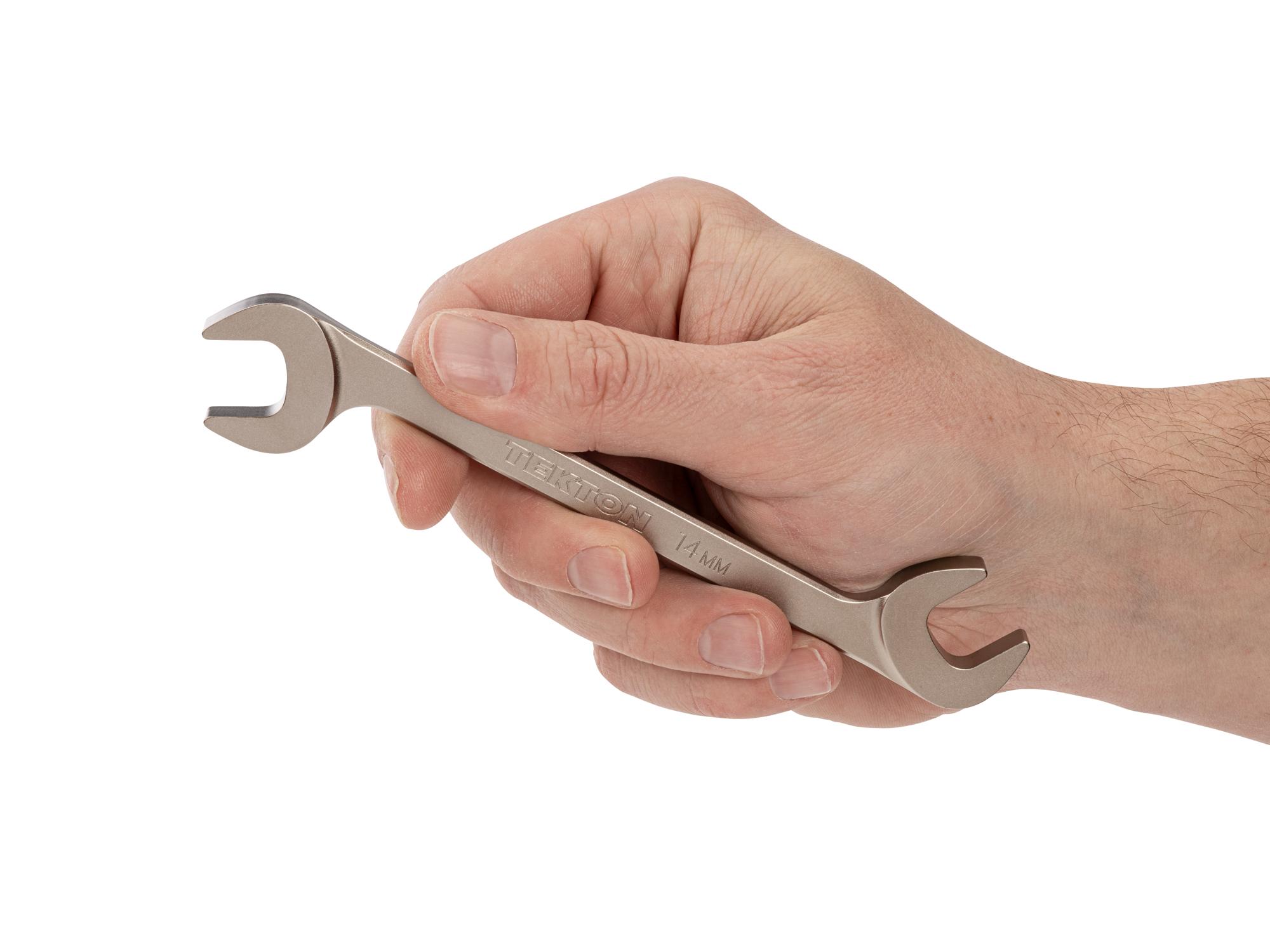 Person holding Tekton angle head wrench. Item #WAE84214