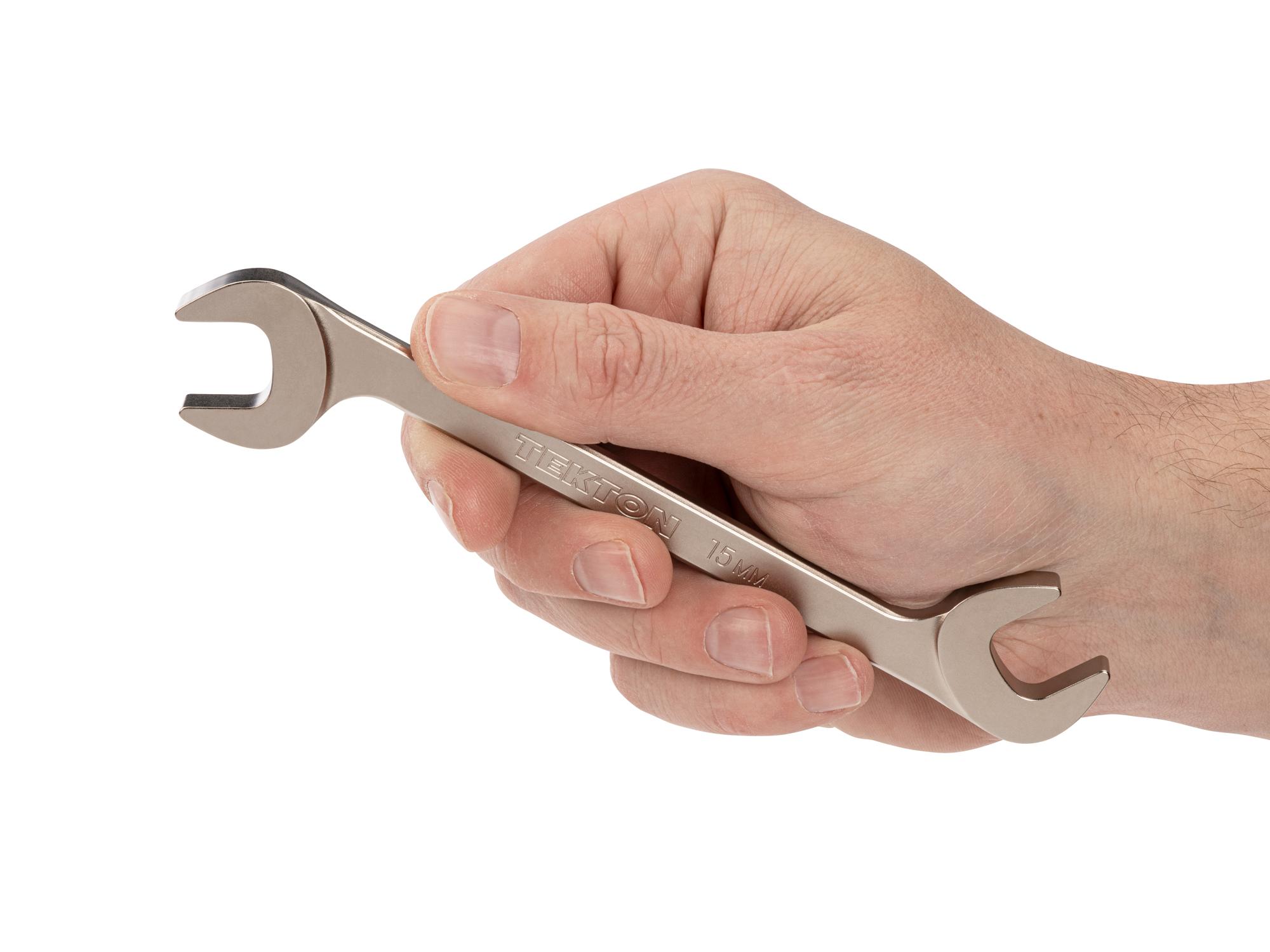 Person holding Tekton angle head wrench. Item #WAE84215