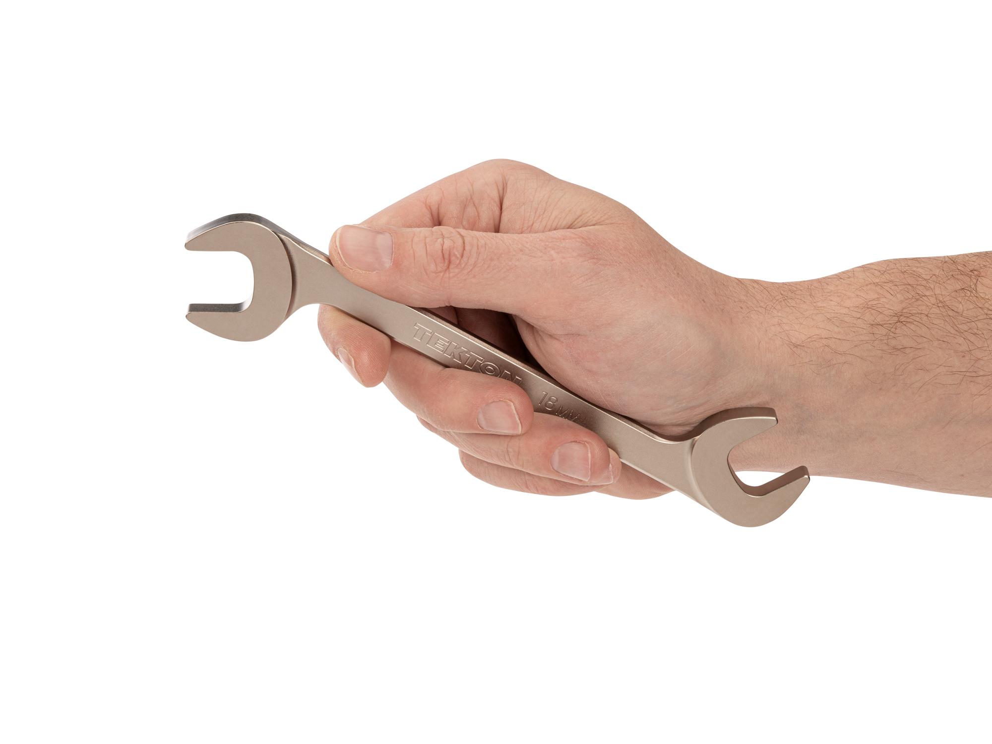 Person holding Tekton angle head wrench. Item #WAE84218