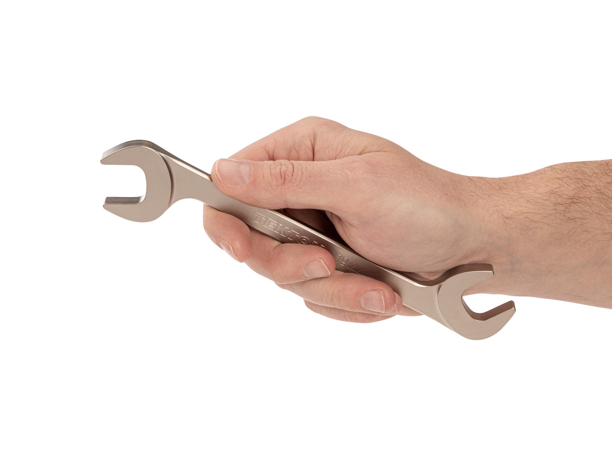 Person holding Tekton angle head wrench. Item #WAE84219