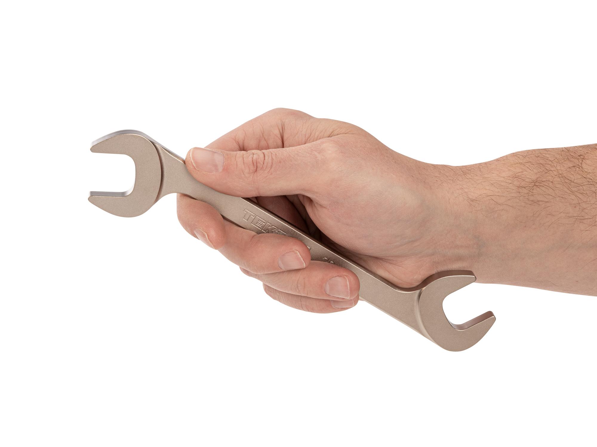 Person holding Tekton angle head wrench. Item #WAE84220