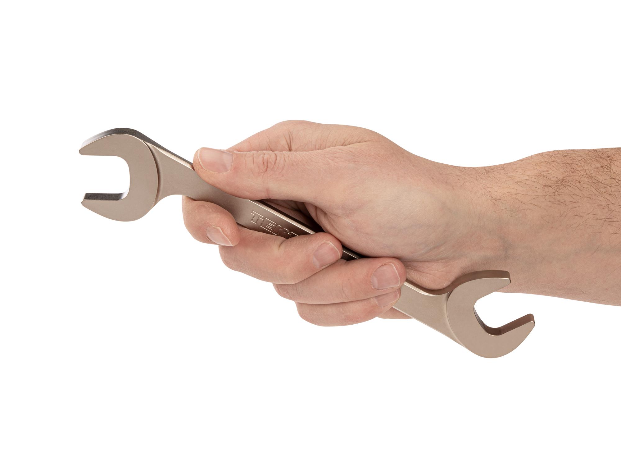 Person holding Tekton angle head wrench. Item #WAE84221