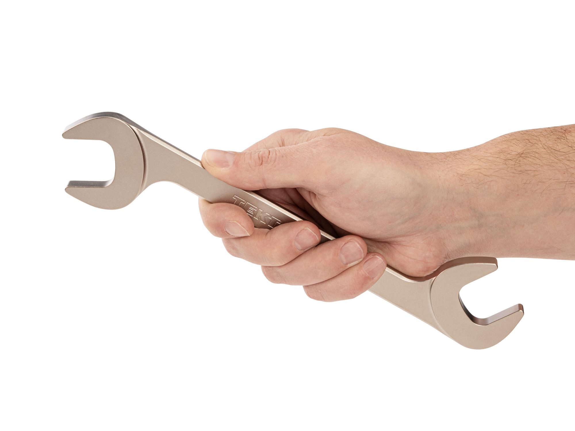 Person holding Tekton angle head wrench. Item #WAE84226