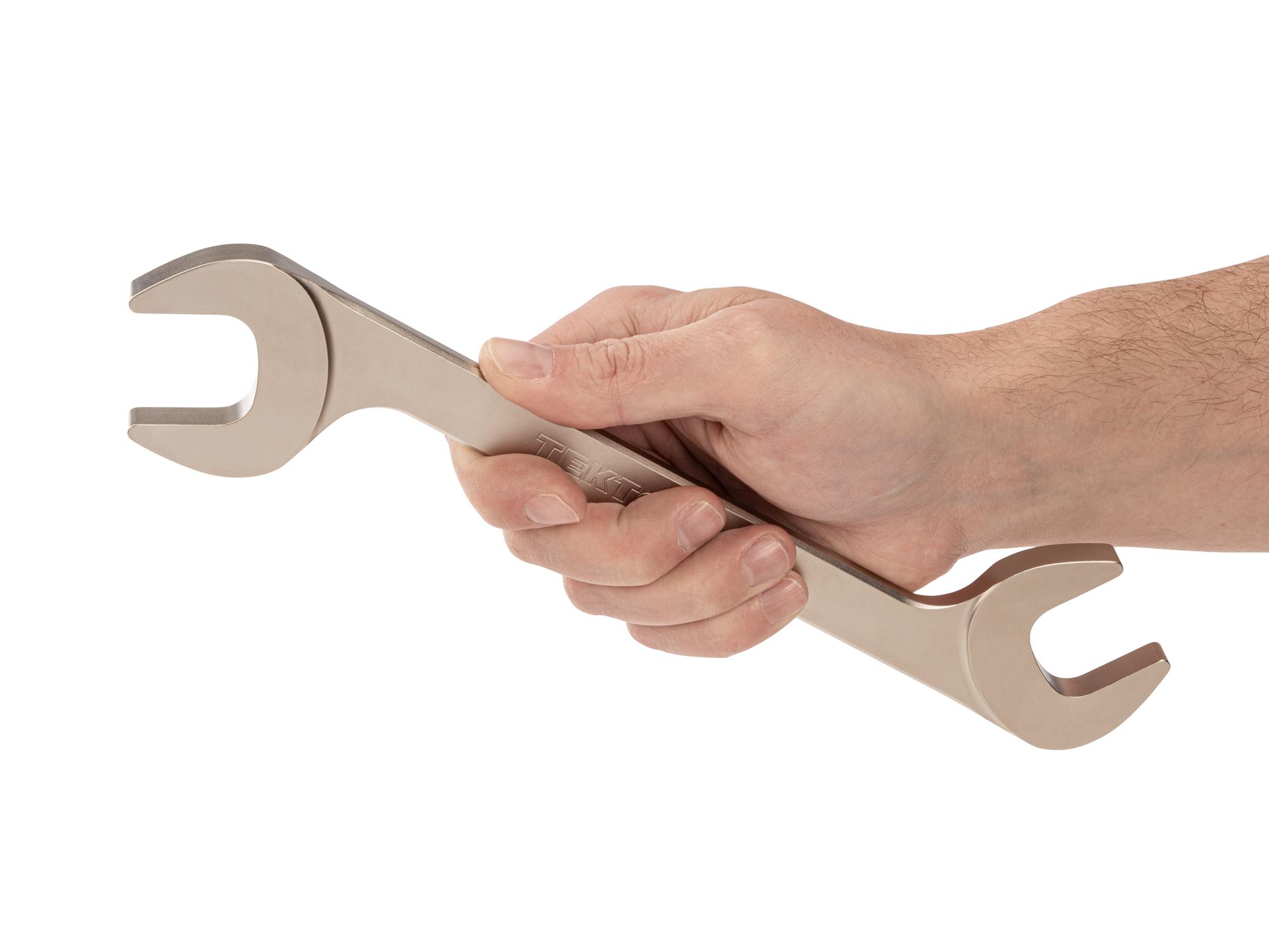 Person holding Tekton angle head wrench. Item #WAE84229