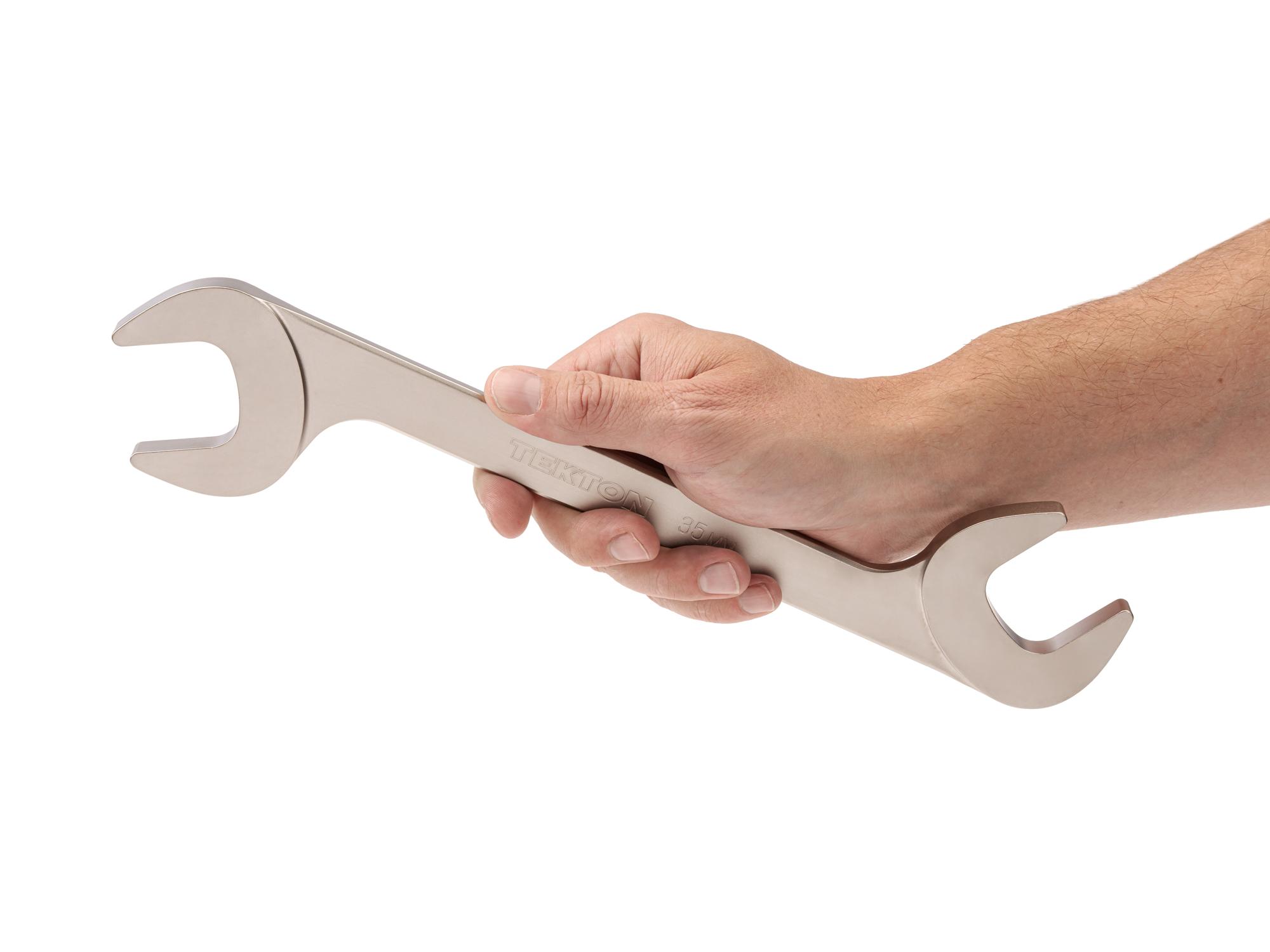Person holding Tekton angle head wrench. Item #WAE84235