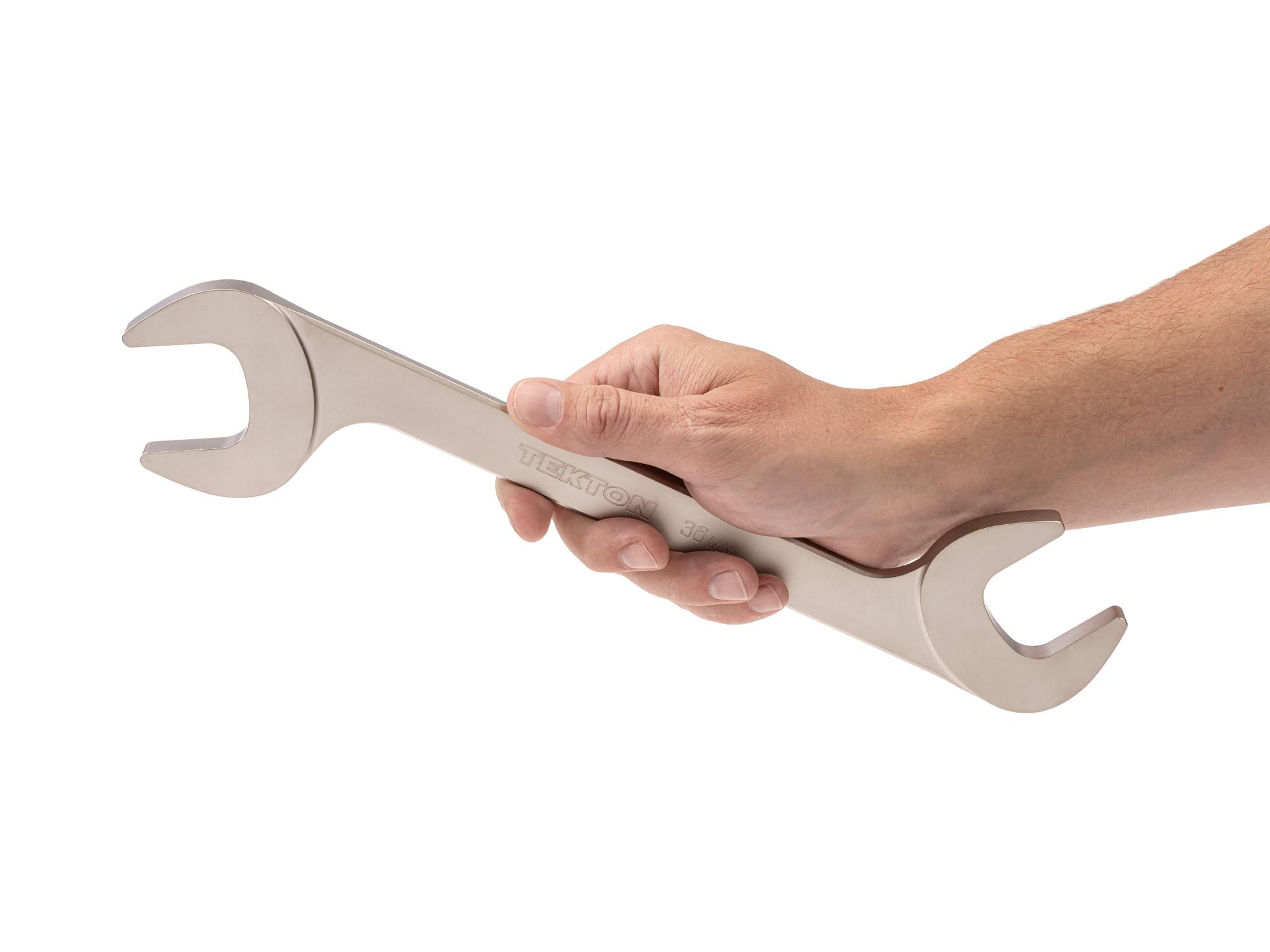 Person holding Tekton angle head wrench. Item #WAE84236