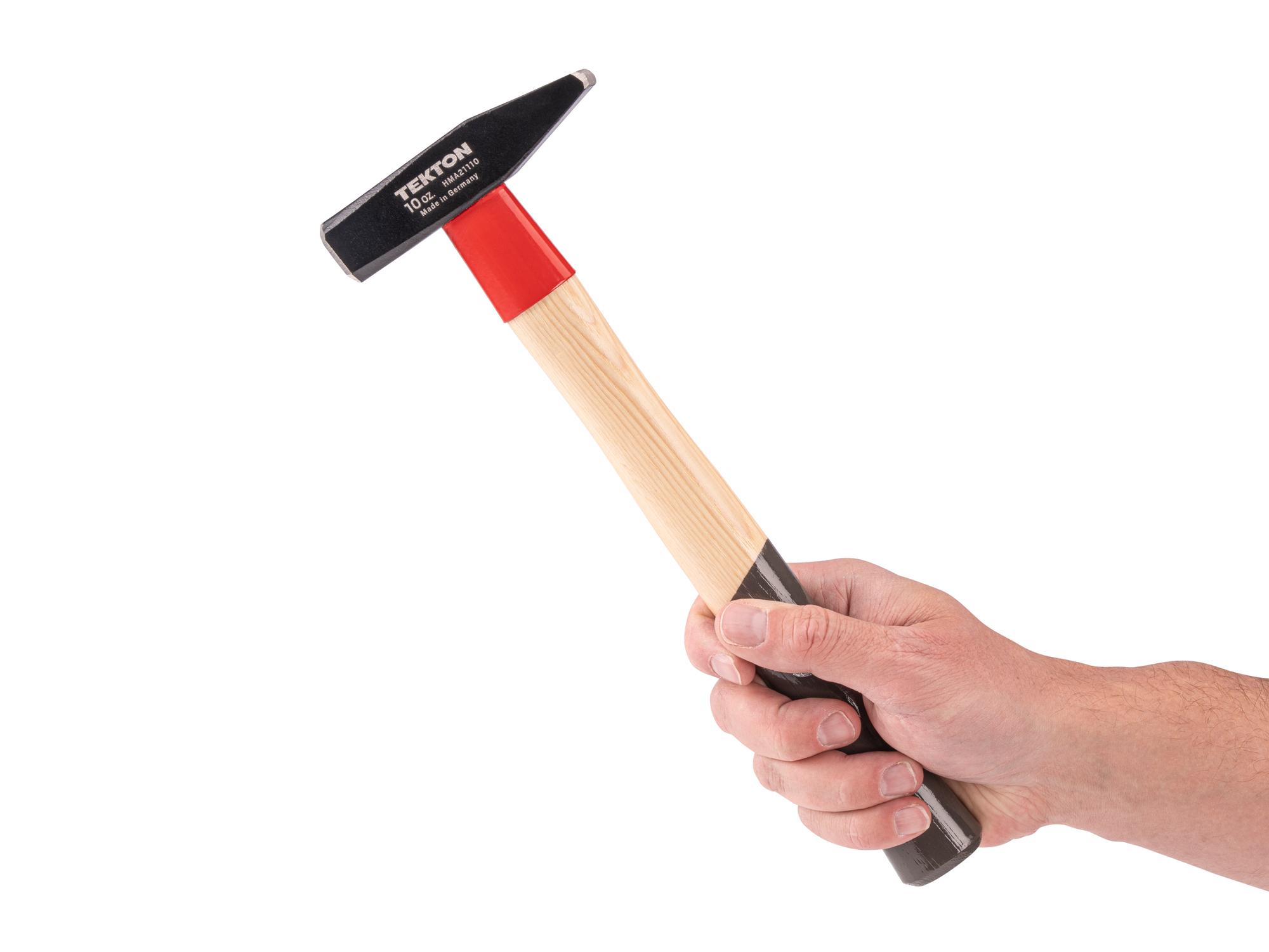 Person holding Tekton ball peen hammer. Item #HMA21110