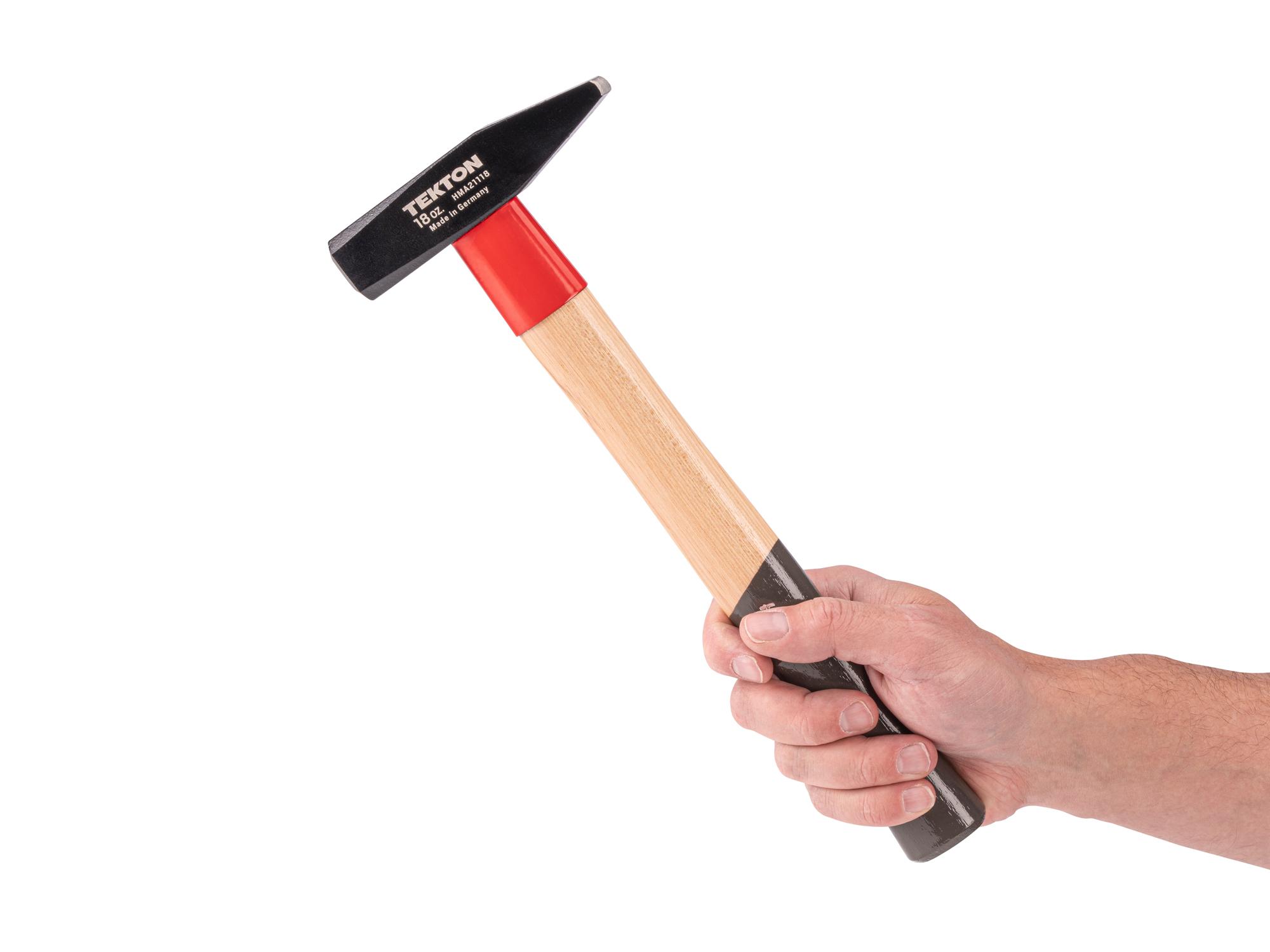Person holding Tekton ball peen hammer. Item #HMA21118