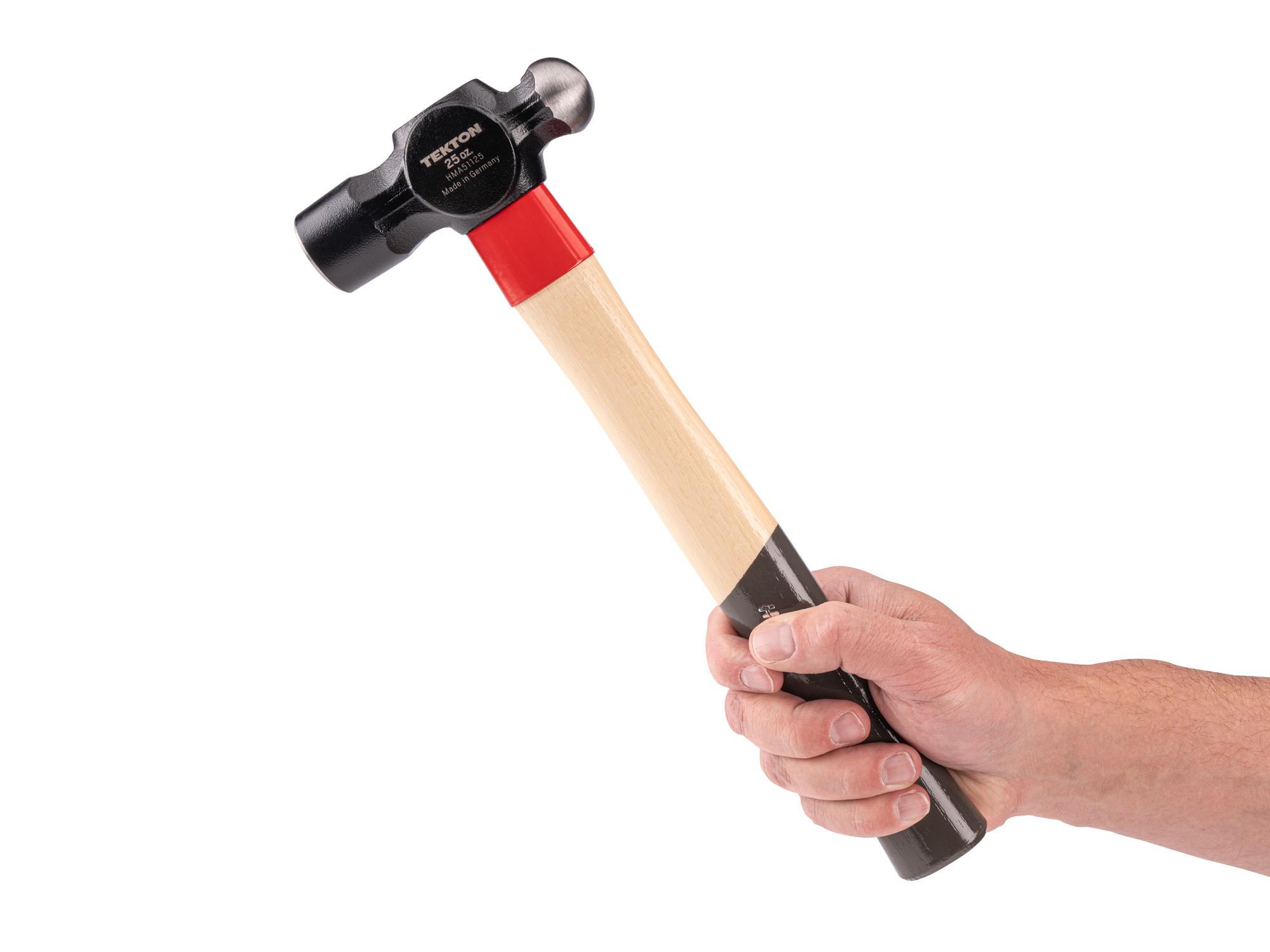 Person holding Tekton ball peen hammer. Item #HMA51125