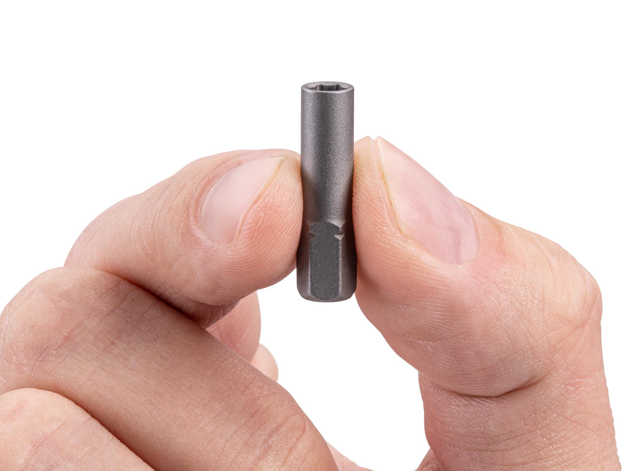 Person holding Tekton bit. Item #DZA31101
