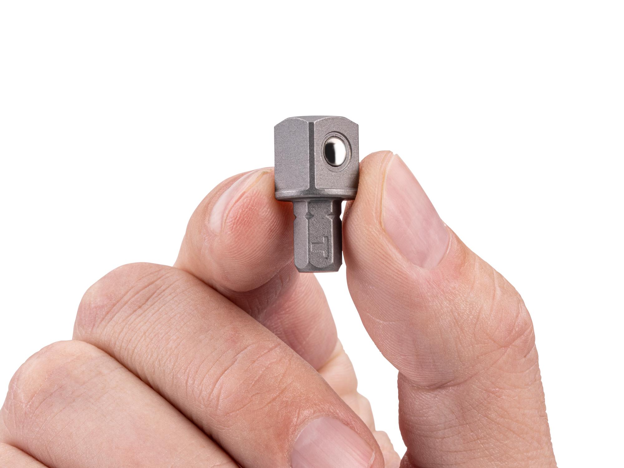 Person holding Tekton bit. Item #DZA31600