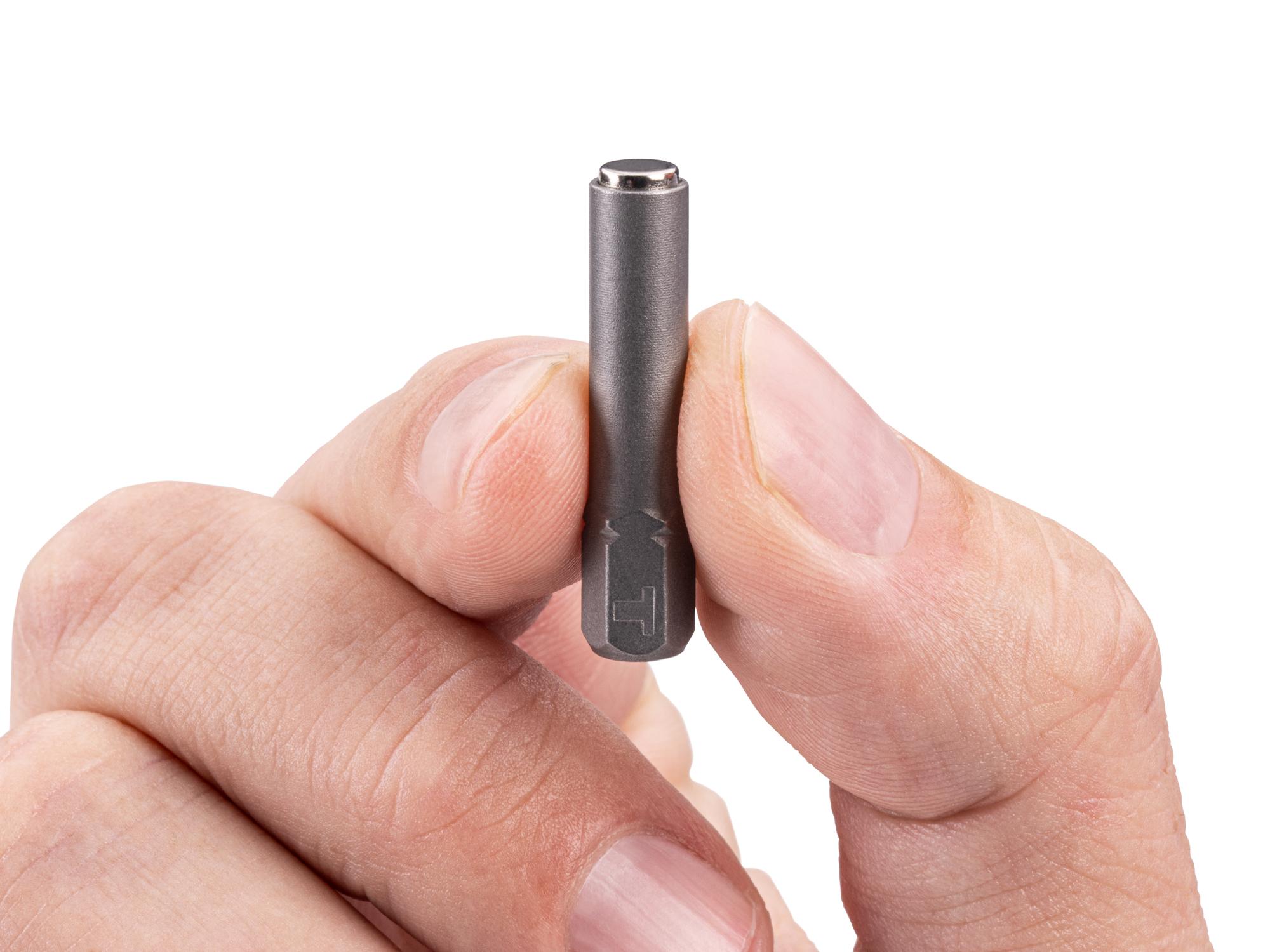 Person holding Tekton bit. Item #DZA33100