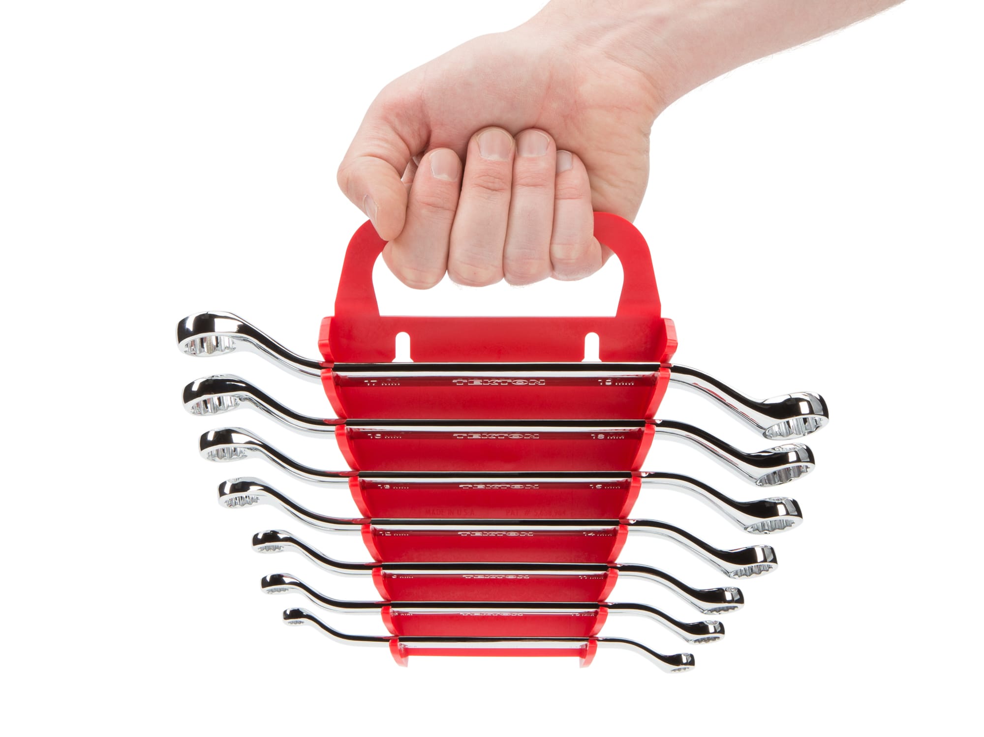 Person Holding 7-piece metric box end wrench set in a red holder