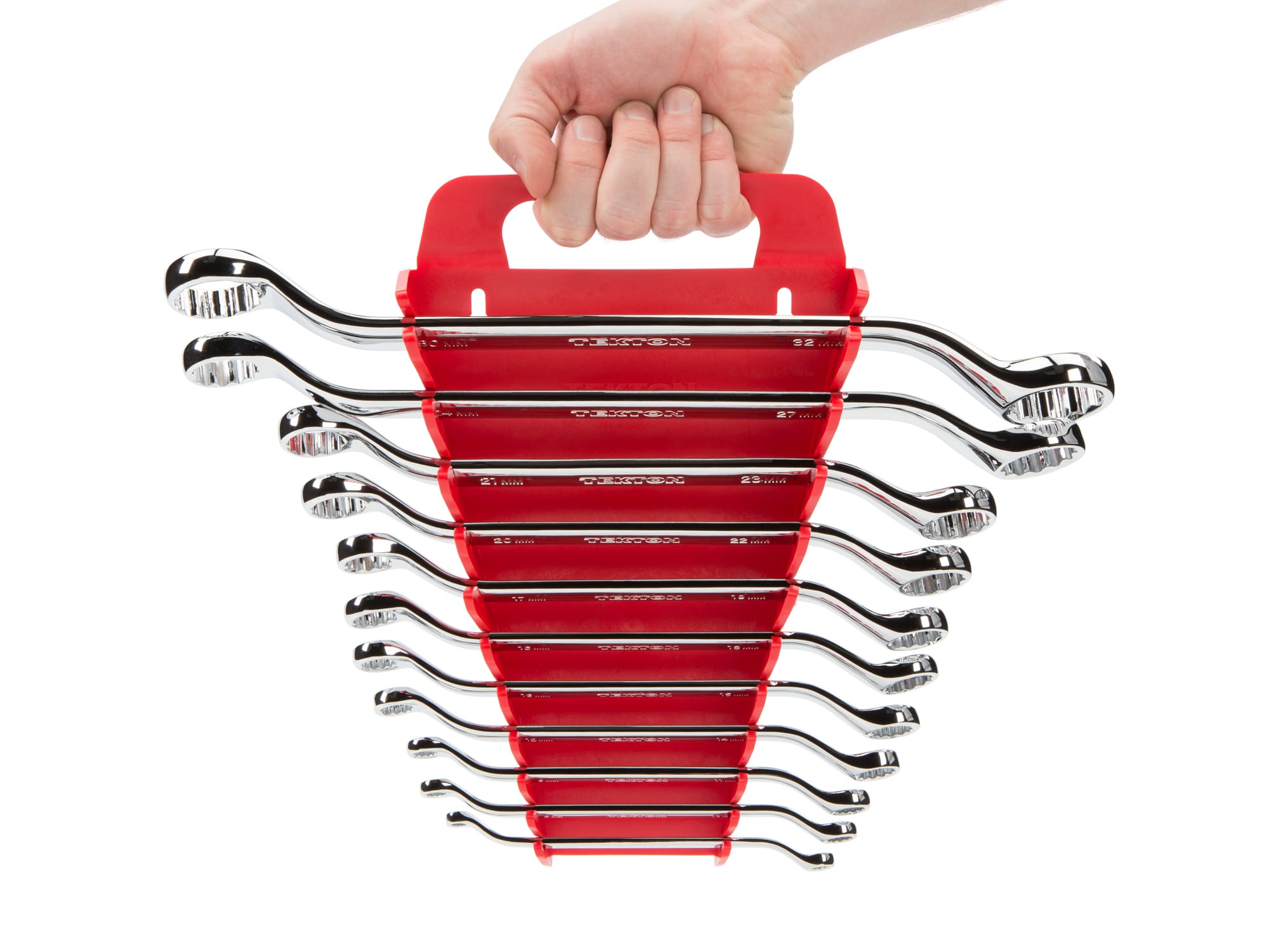 Person Holding 11-piece metric box end wrench set in a red holder