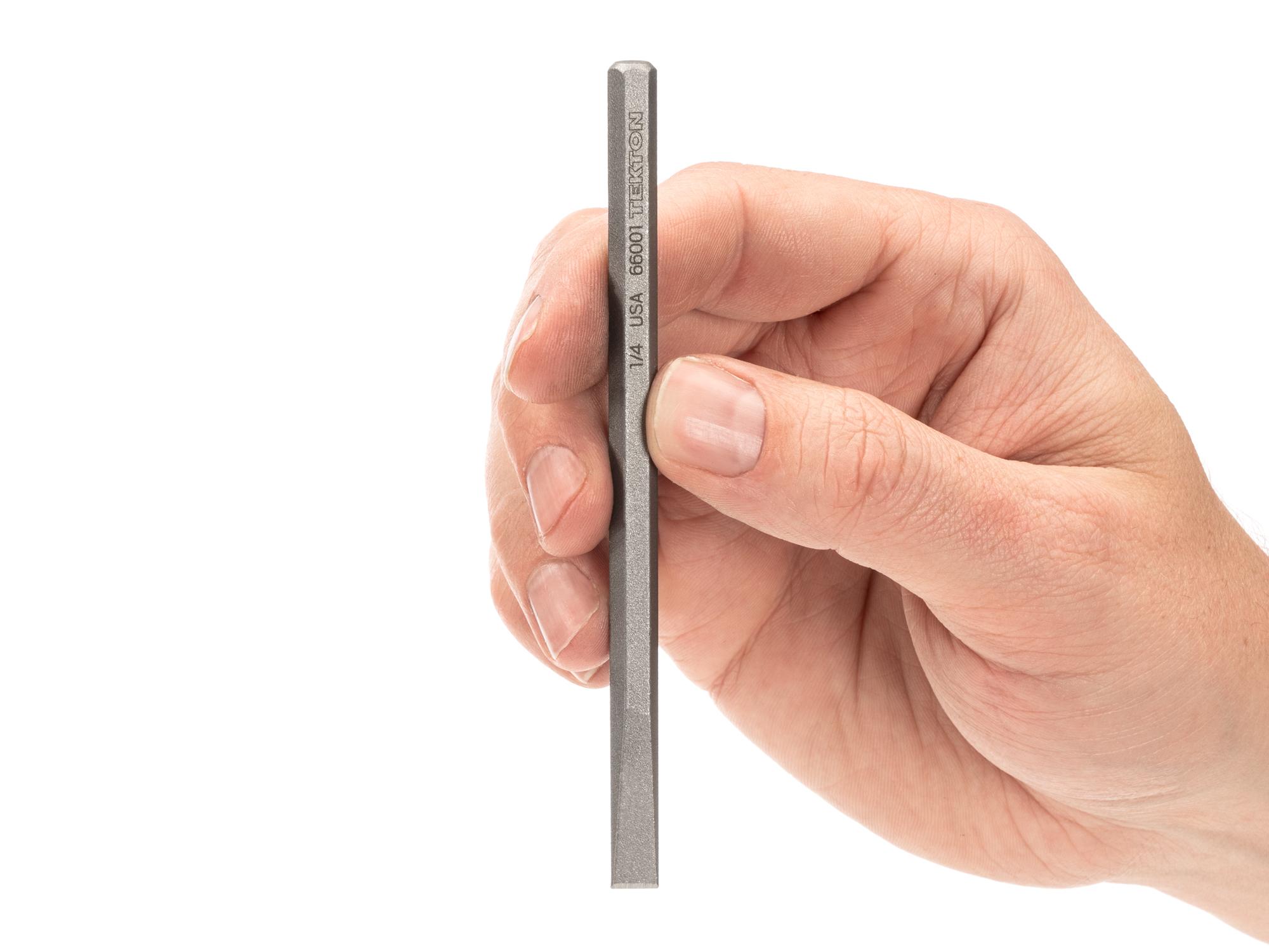 Person holding Tekton cold chisel. Item #66001