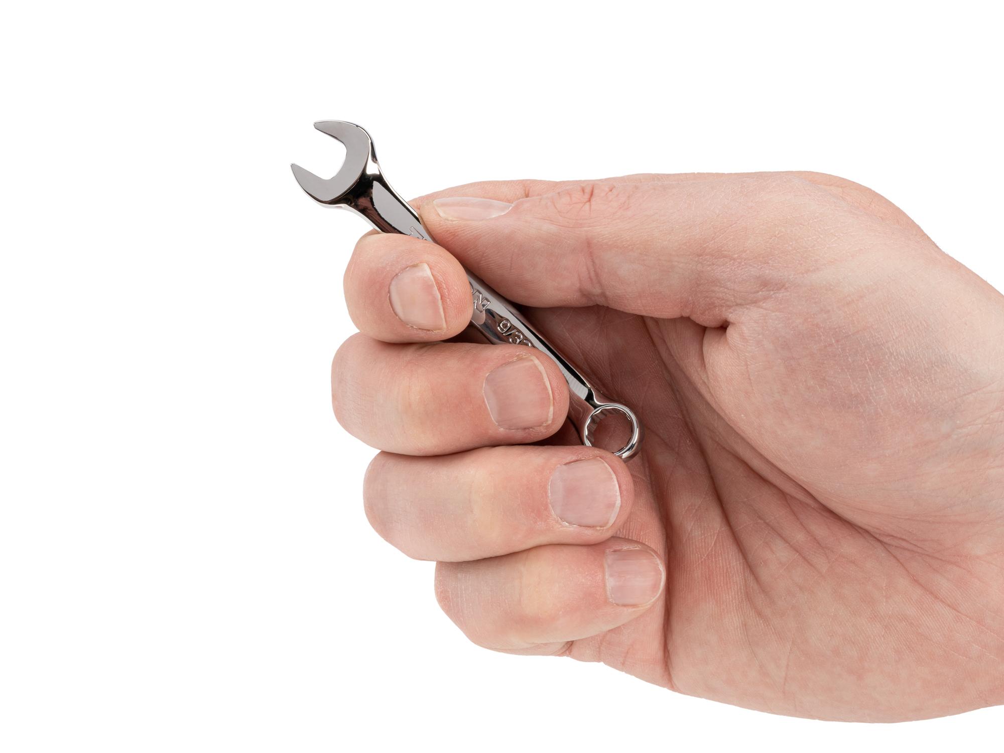 Person holding Tekton combination wrench. Item #18042