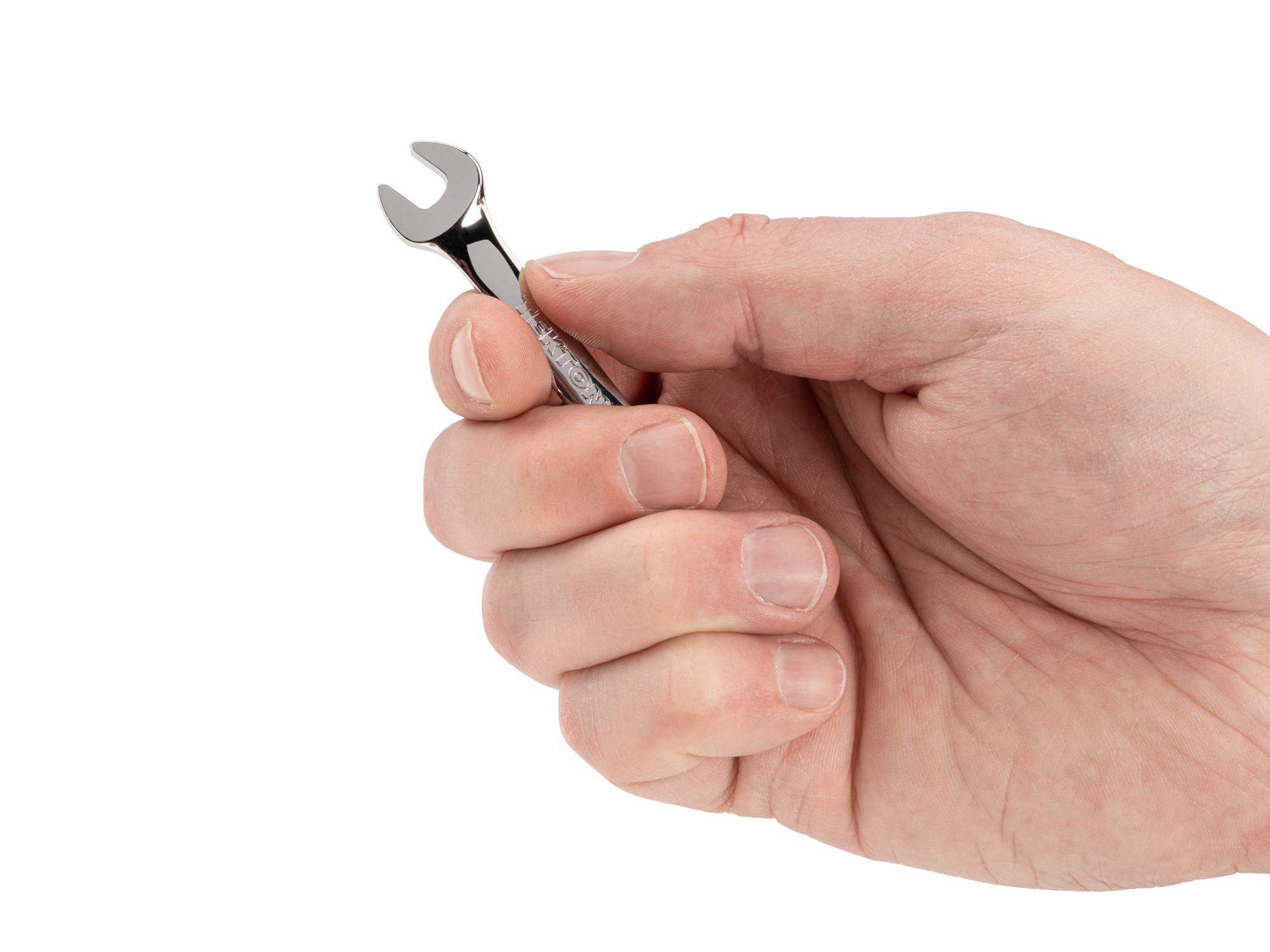 Person holding Tekton combination wrench. Item #18061