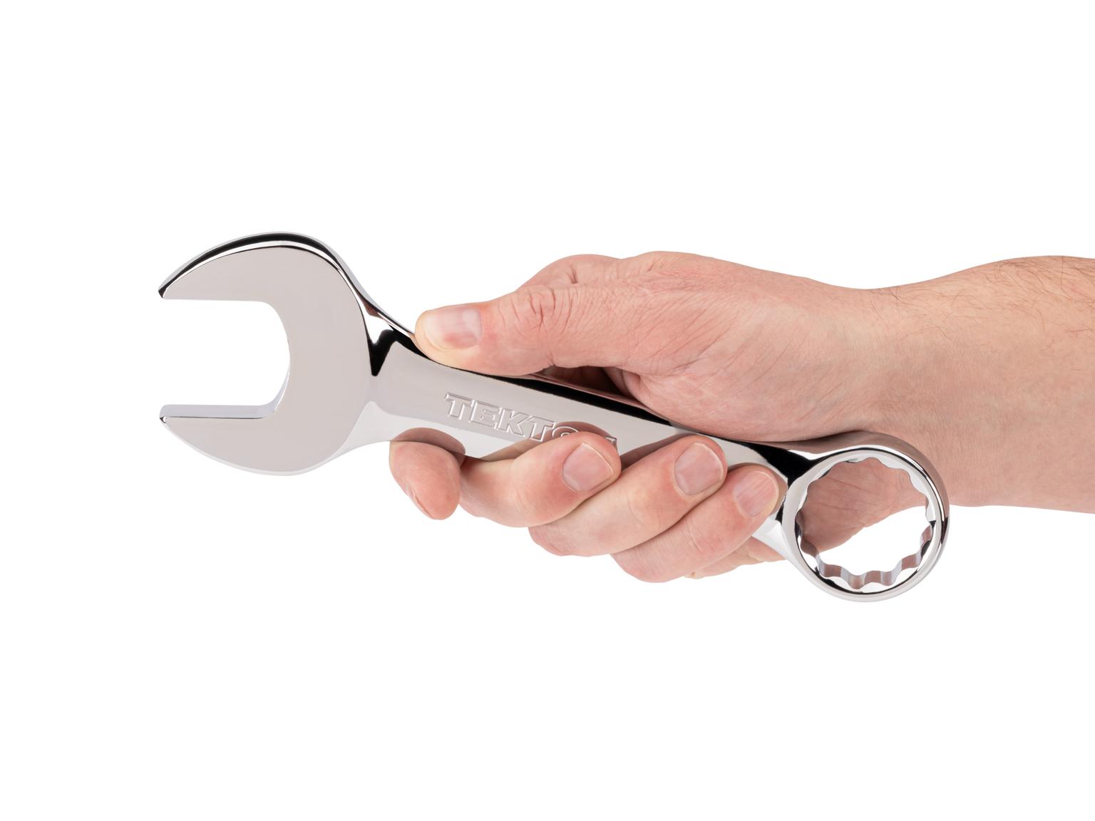 Person holding Tekton combination wrench. Item #18087