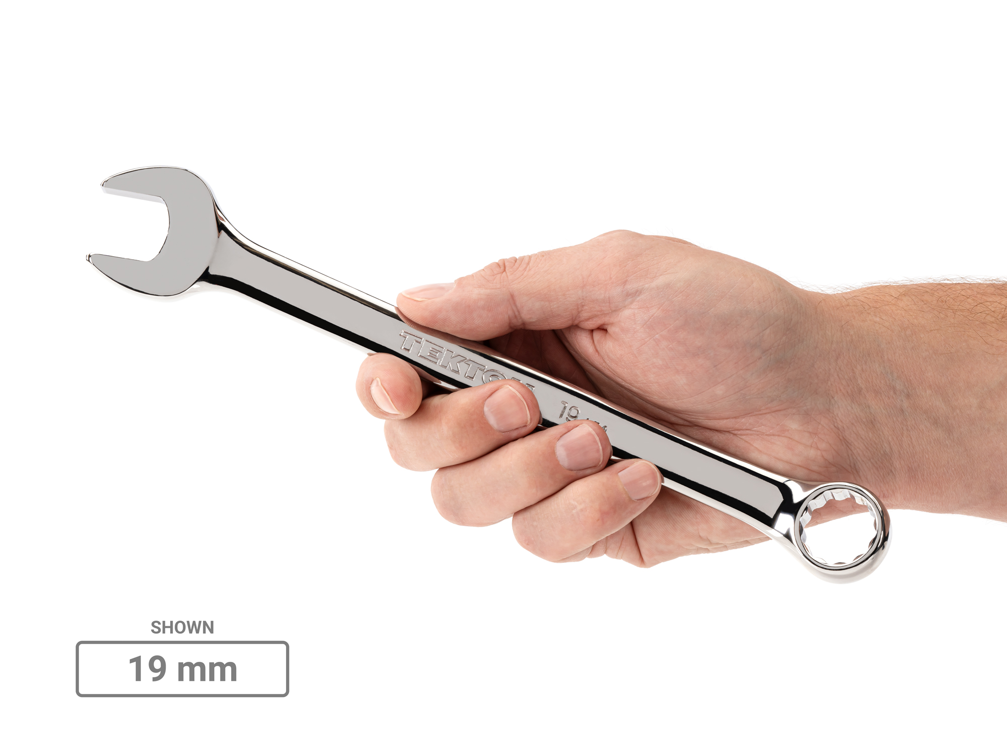 Person holding Tekton 19 millimetercombination wrench. Item #18289