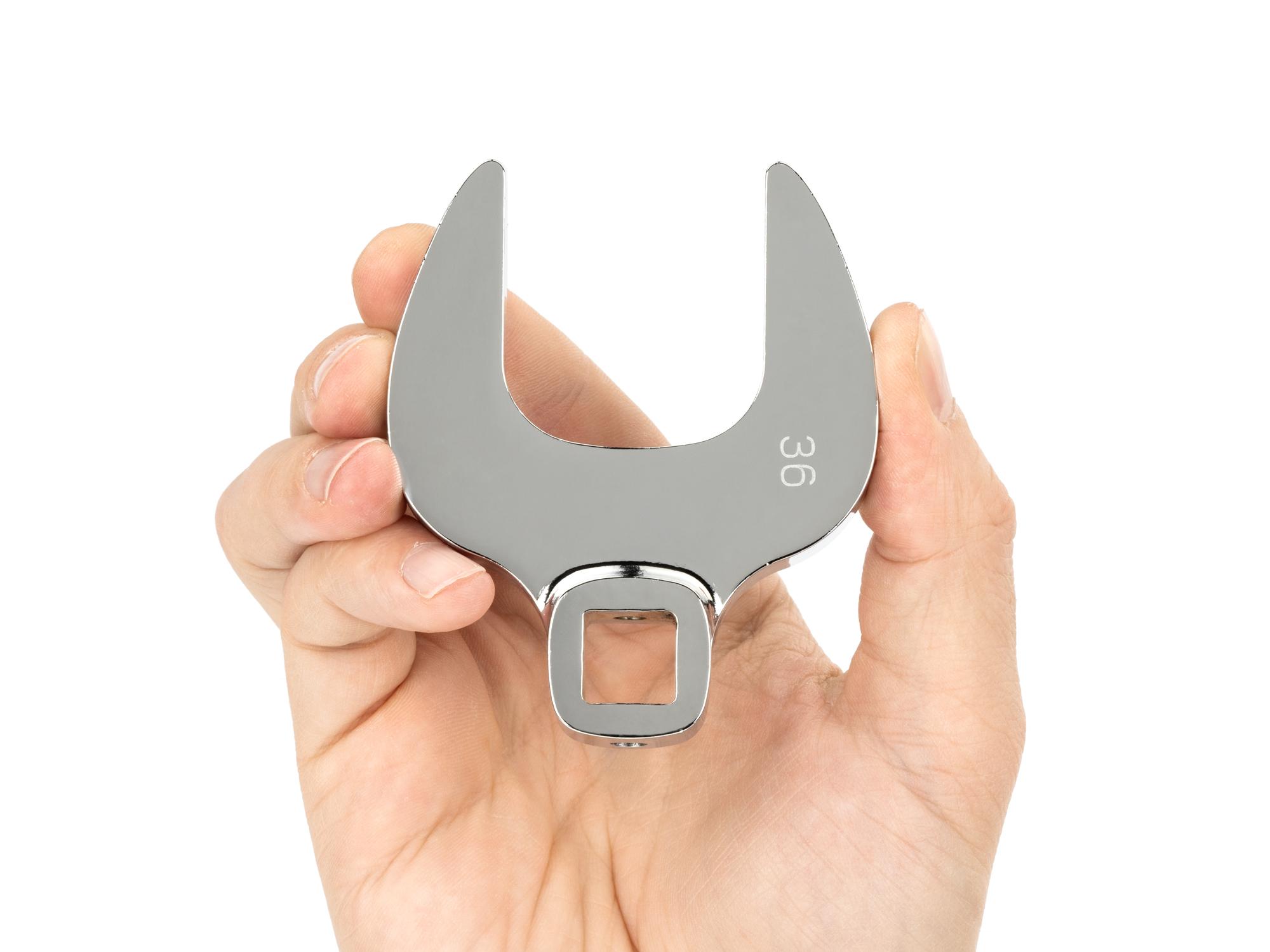 Person holding  Tekton crowfoot wrench set. Item #WCF90504