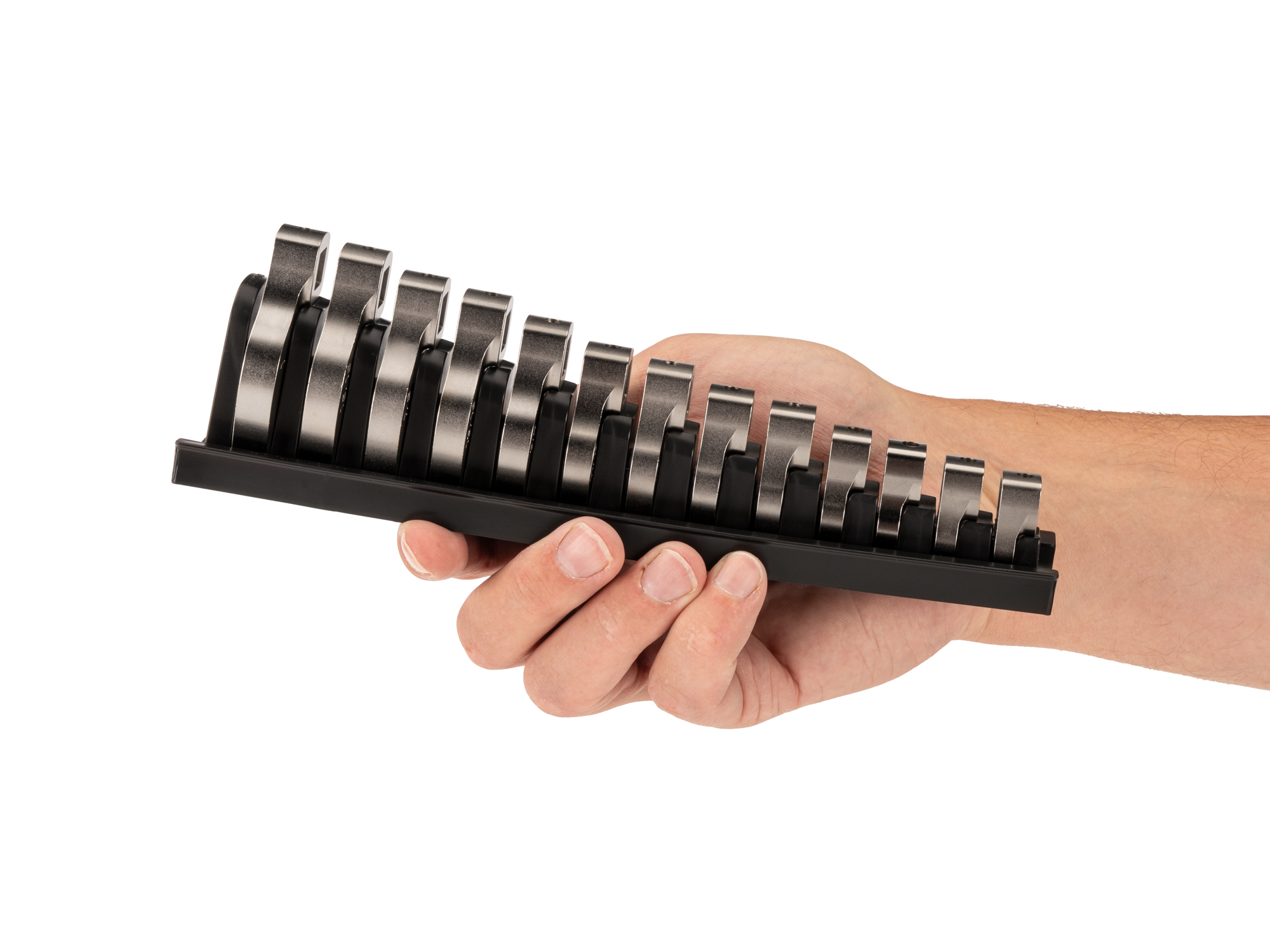 Person Holding 13-piece inch crowfoot wrench set in a black rack