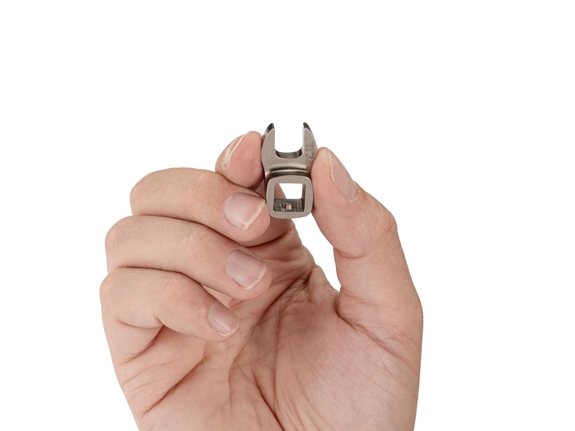 Person holding Tekton crowfoot wrench. Item #WCF13109