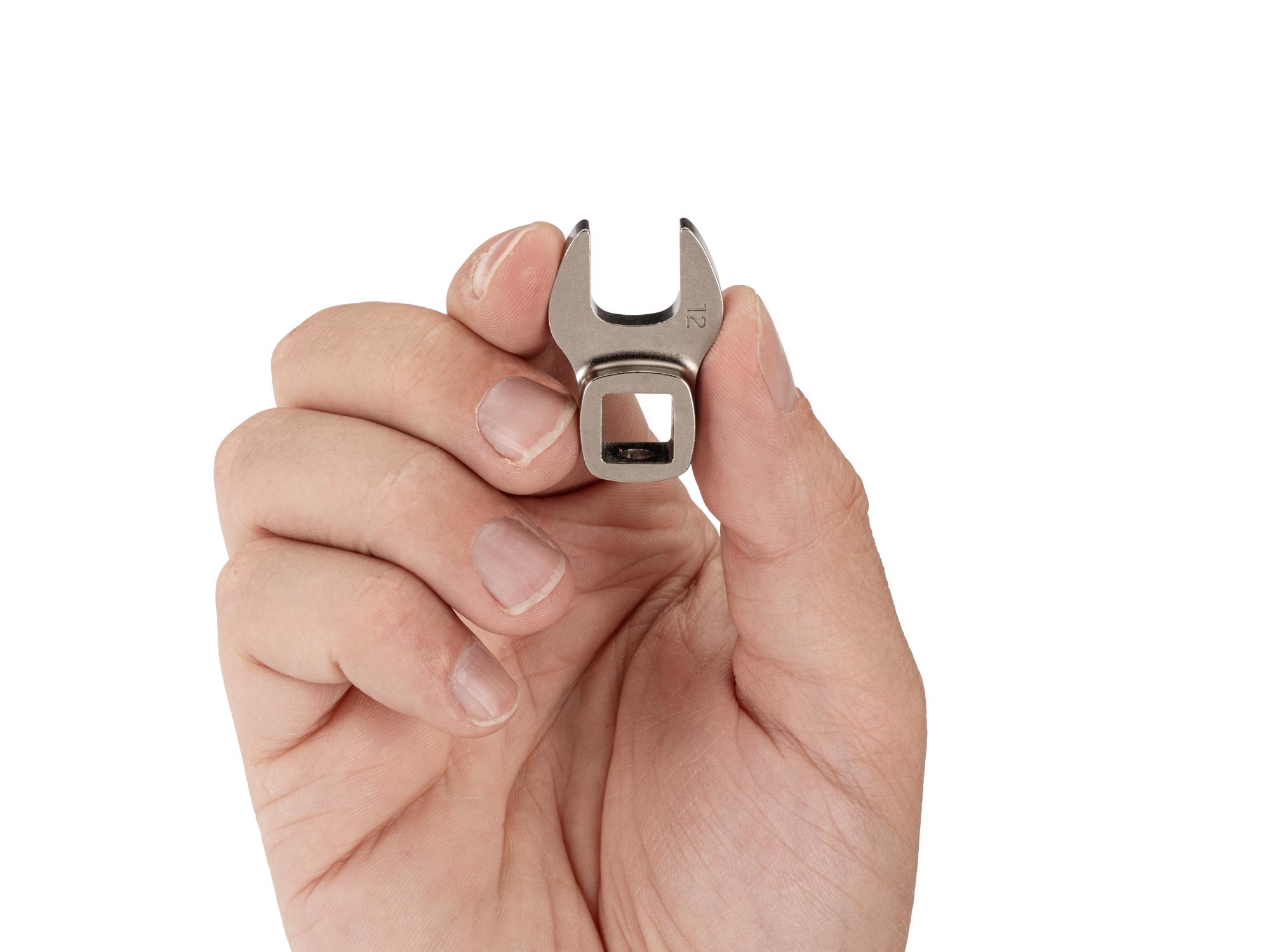 Person holding Tekton crowfoot wrench. Item #WCF14112