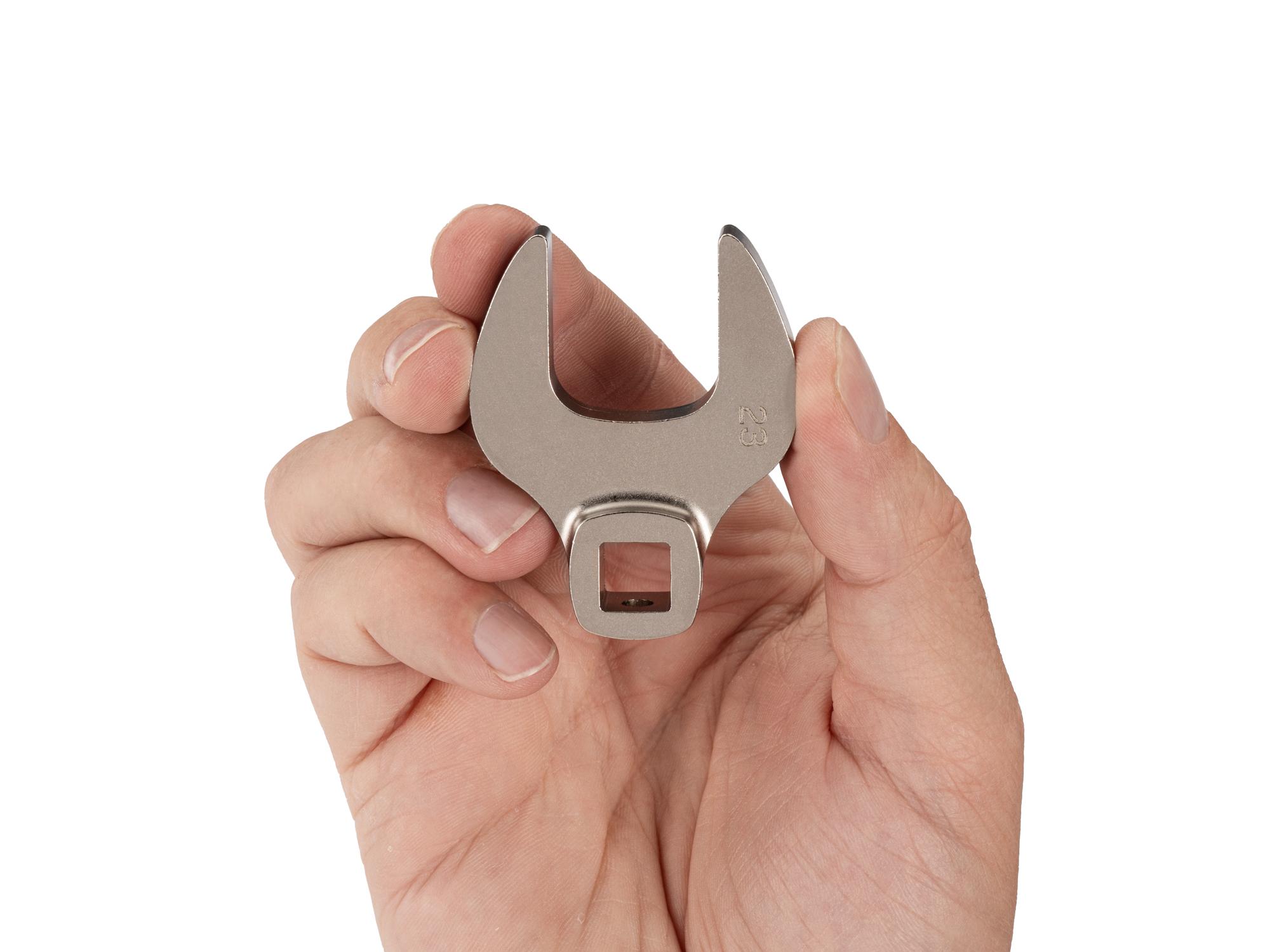 Person holding Tekton crowfoot wrench. Item #WCF14123