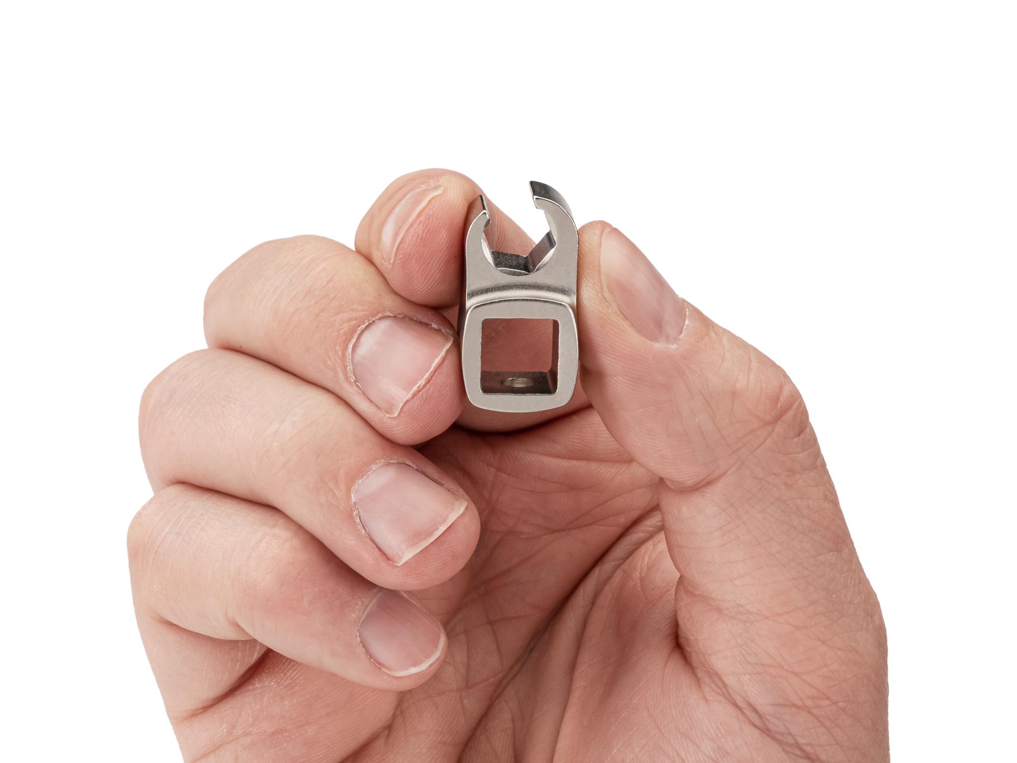 Person holding Tekton crowfoot wrench. Item #WCF15208