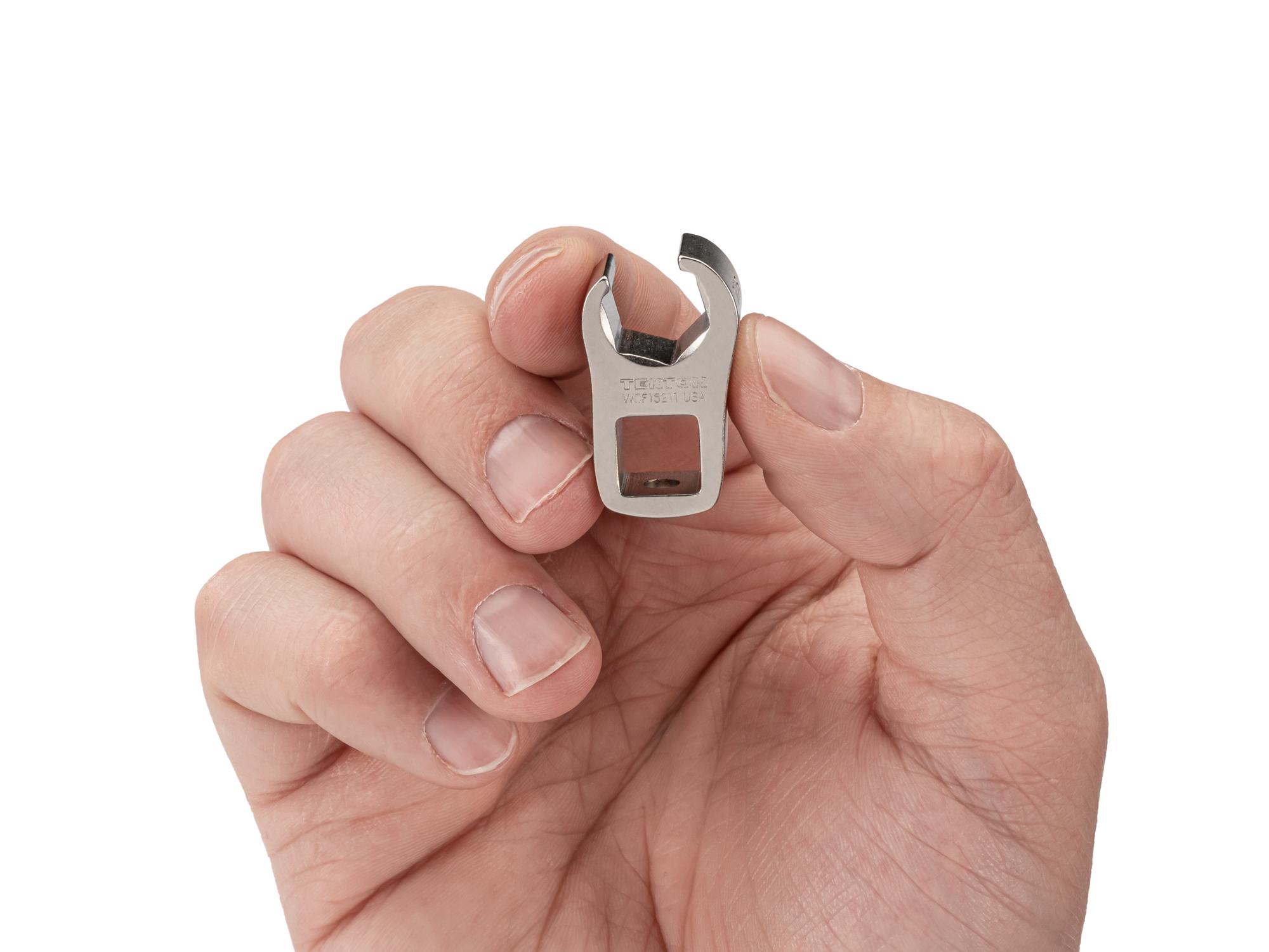 Person holding Tekton crowfoot wrench. Item #WCF15211