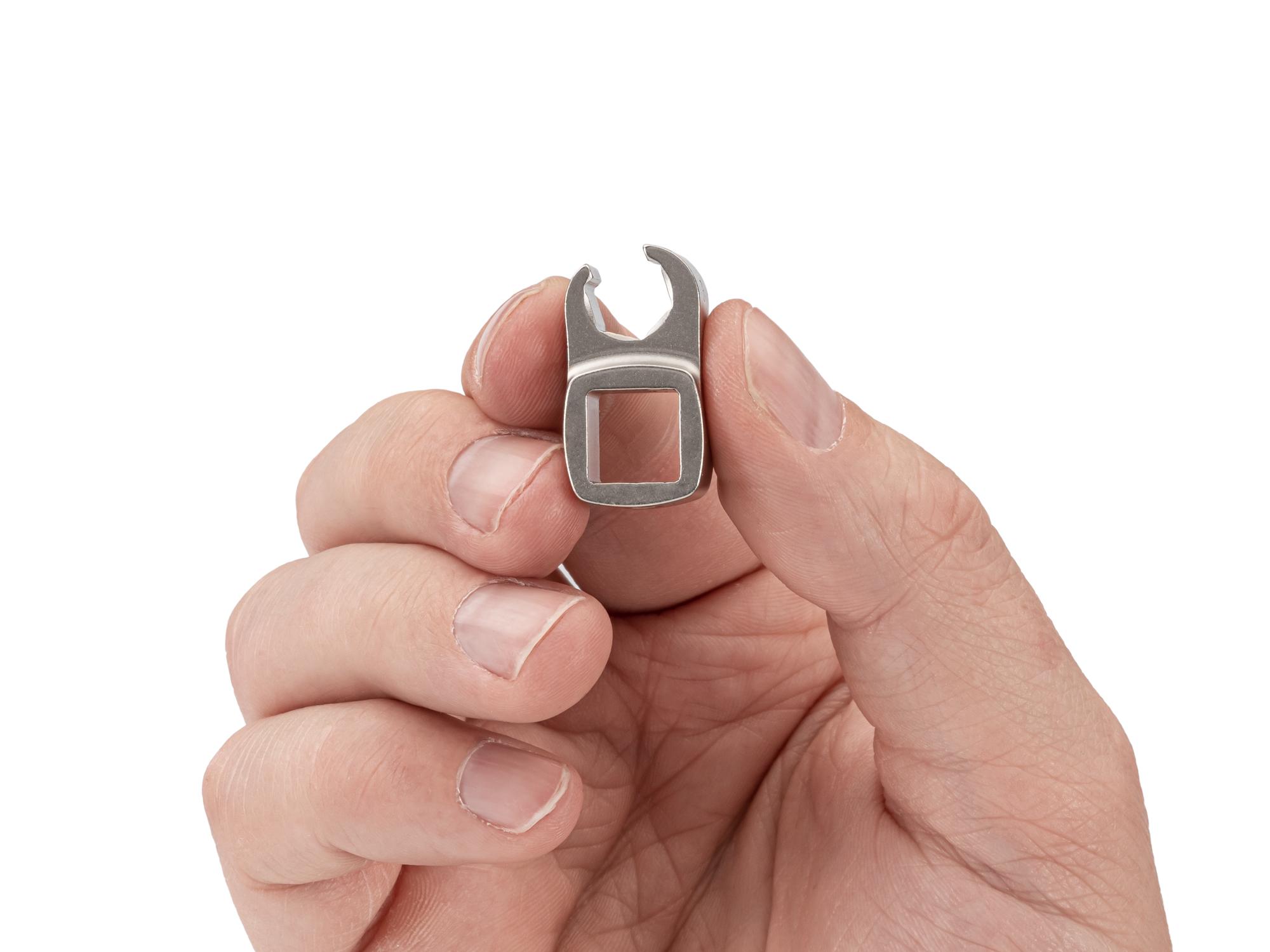 Person holding Tekton crowfoot wrench. Item #WCF16208