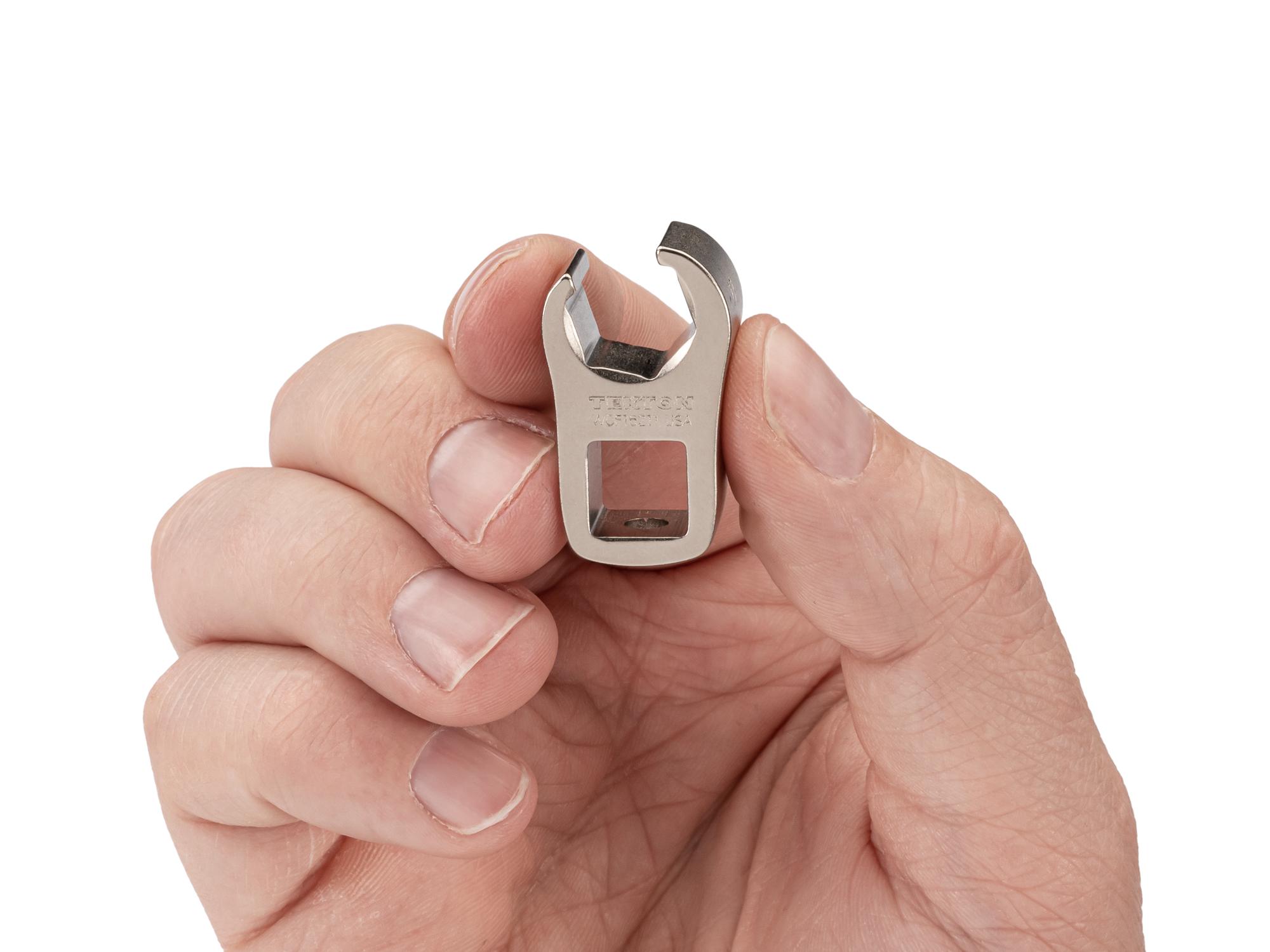 Person holding Tekton crowfoot wrench. Item #WCF16211