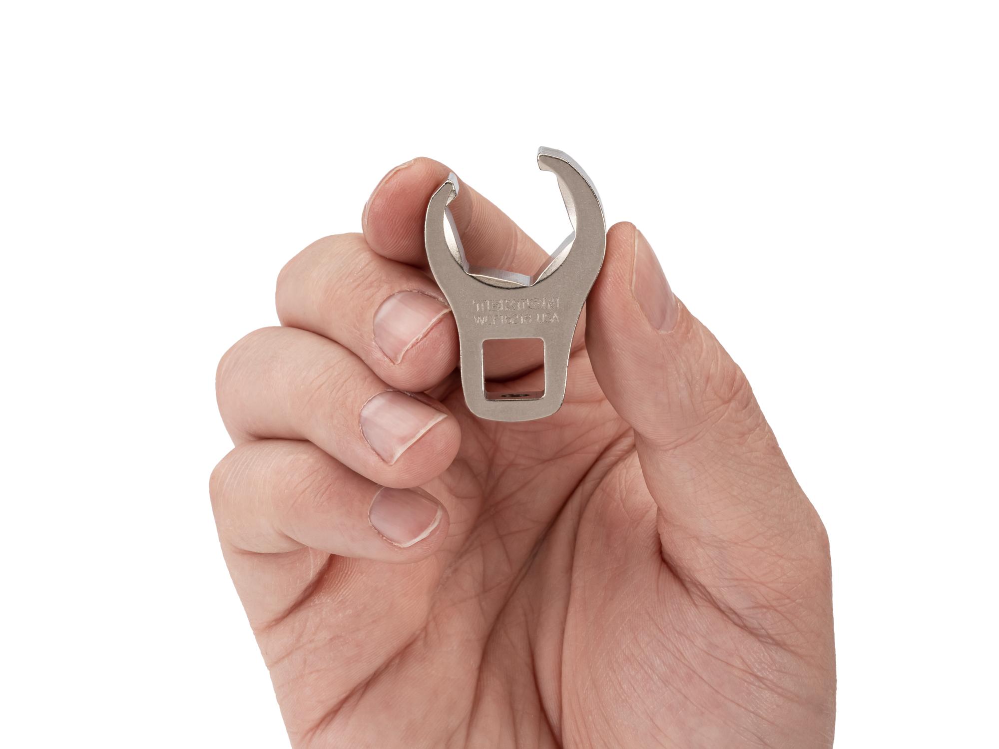 Person holding Tekton crowfoot wrench. Item #WCF16218