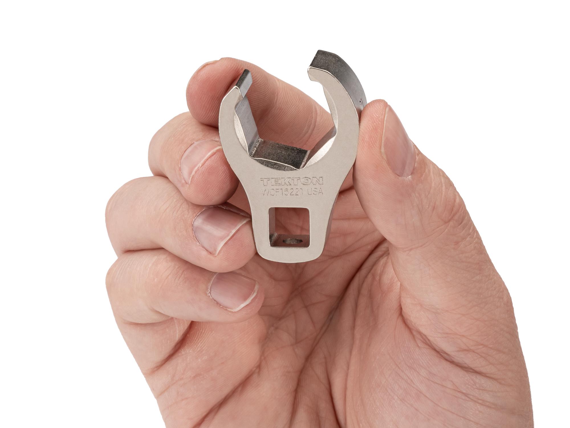 Person holding Tekton crowfoot wrench. Item #WCF16221