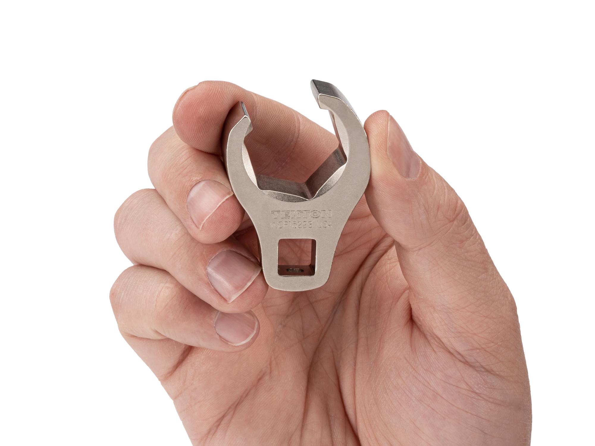 Person holding Tekton crowfoot wrench. Item #WCF16223