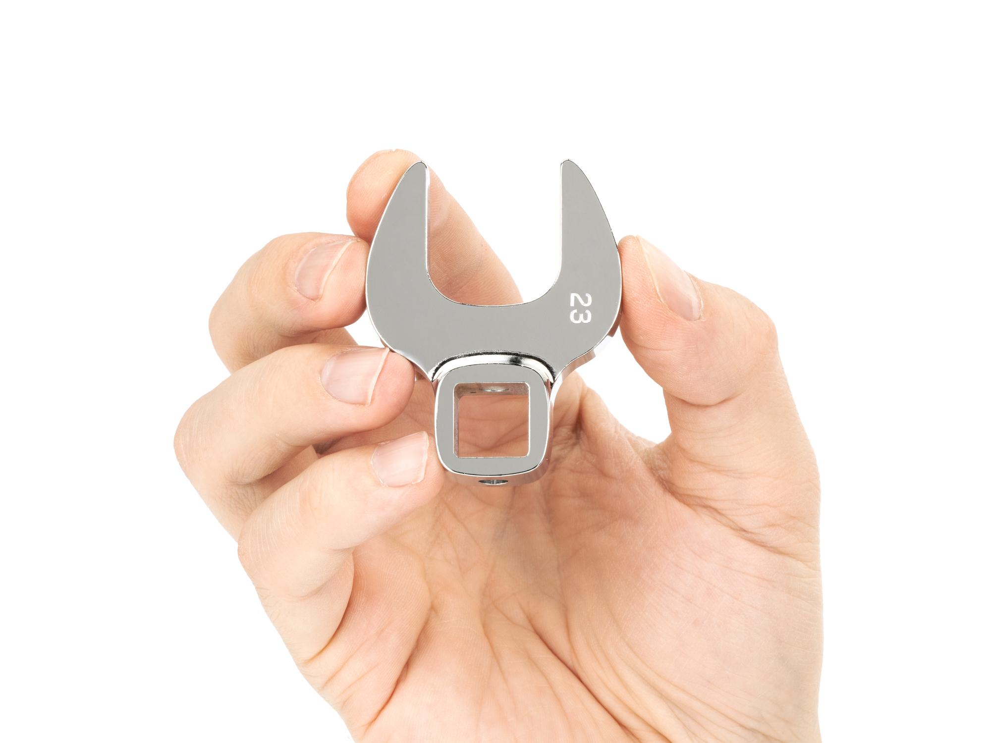 Person holding Tekton crowfoot wrench. Item #WCF24023
