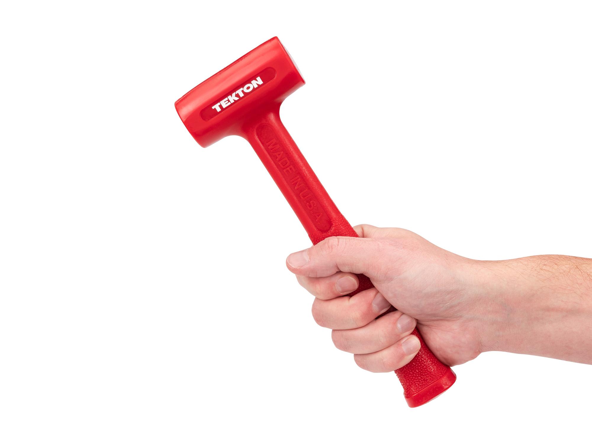 Person holding Tekton dead blow hammer. Item #HDB30013
