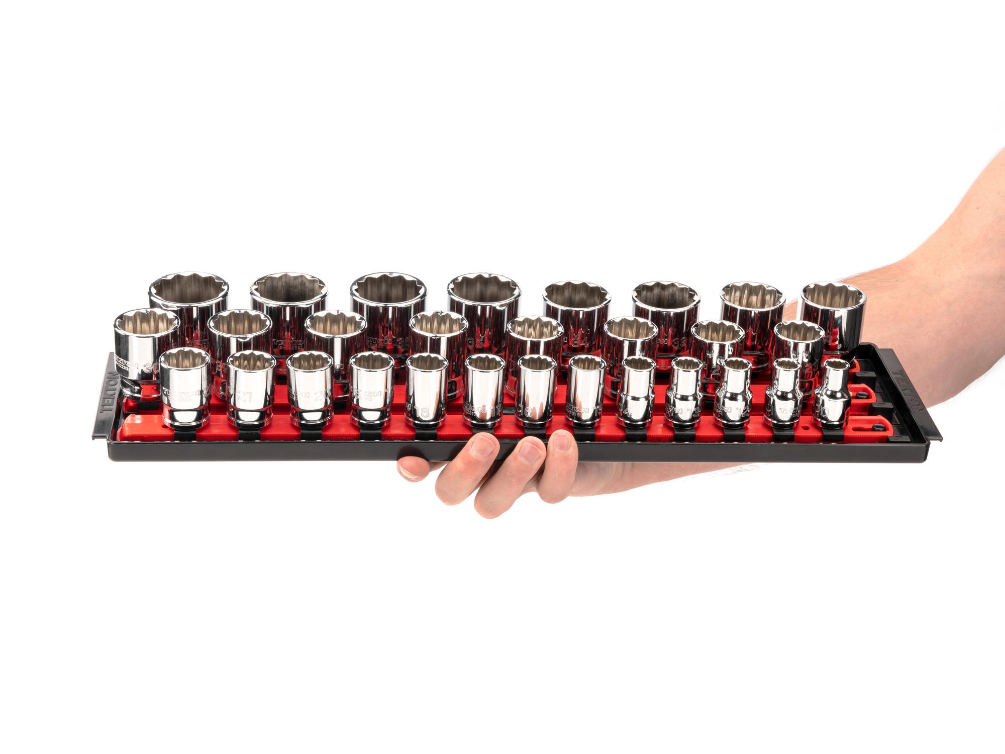 Person holding Tekton rail hand drive 12-point socket set. Item #SHD92128