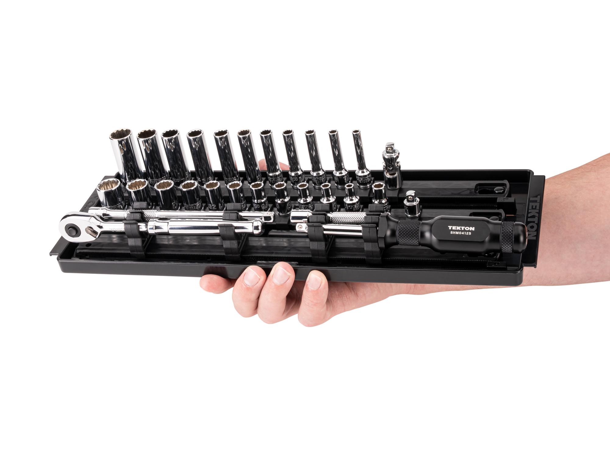 Person holding Tekton rail hand drive 12-point socket set. Item #SKT03102