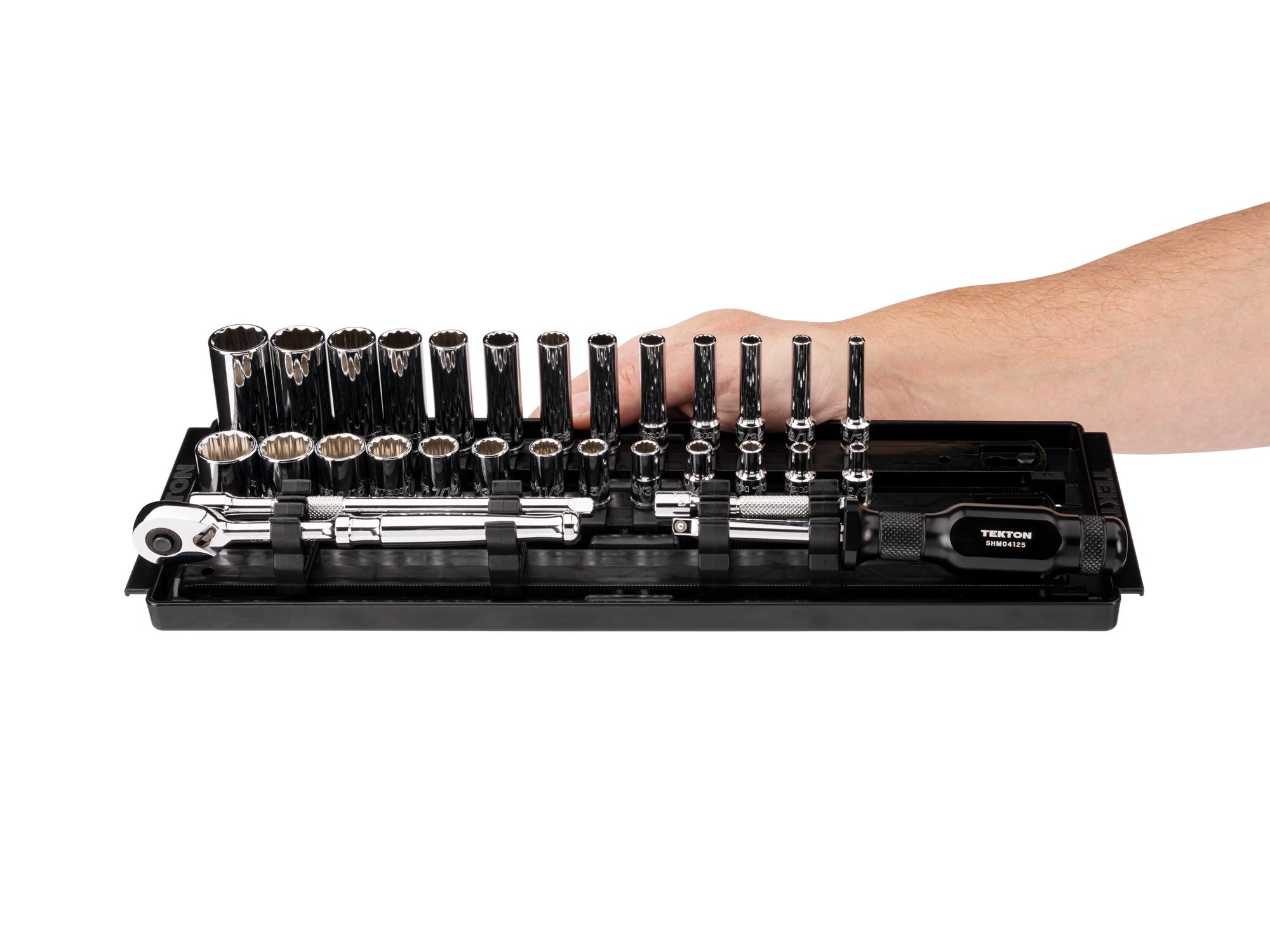 Person holding Tekton rail hand drive 12-point socket set. Item #SKT03104