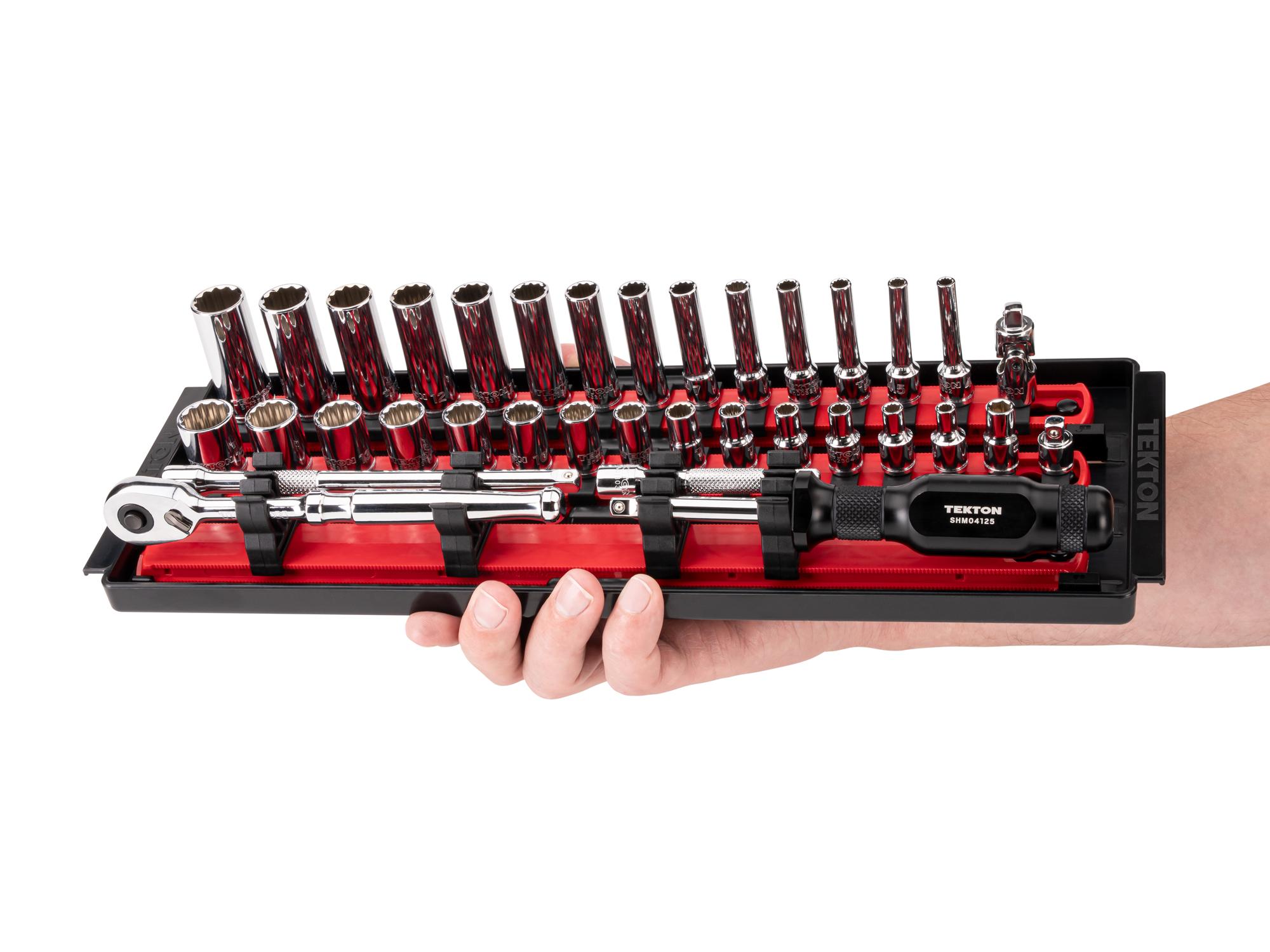 Person holding Tekton rail hand drive 12-point socket set. Item #SKT03302