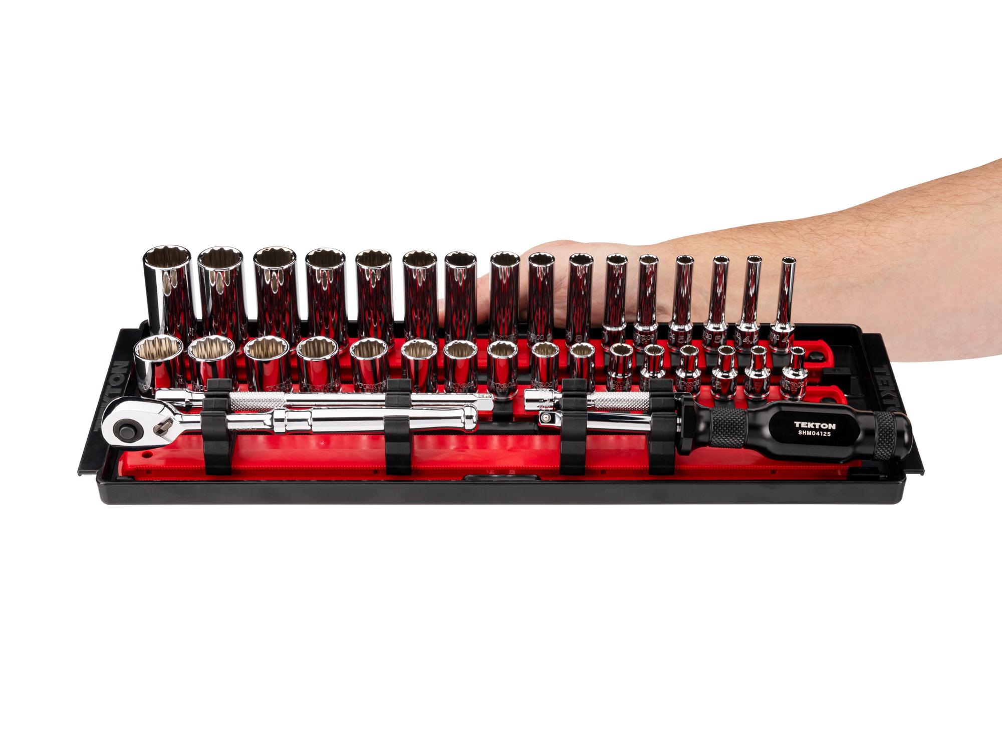 Person holding Tekton rail hand drive 12-point socket set. Item #SKT03204