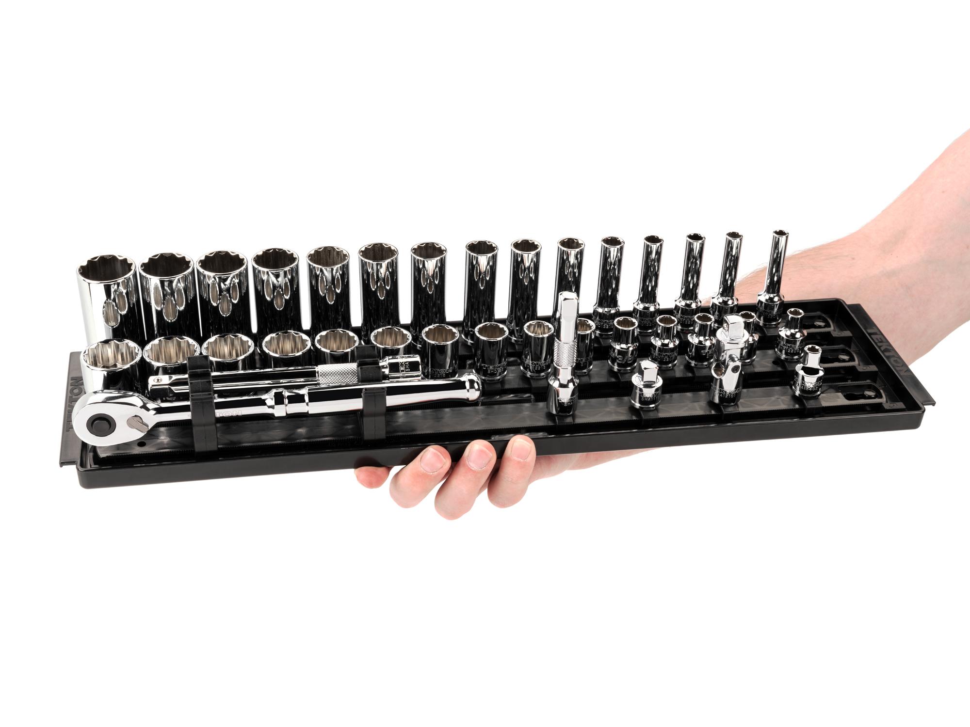 Person holding Tekton rail hand drive 12-point socket set. Item #SKT13102