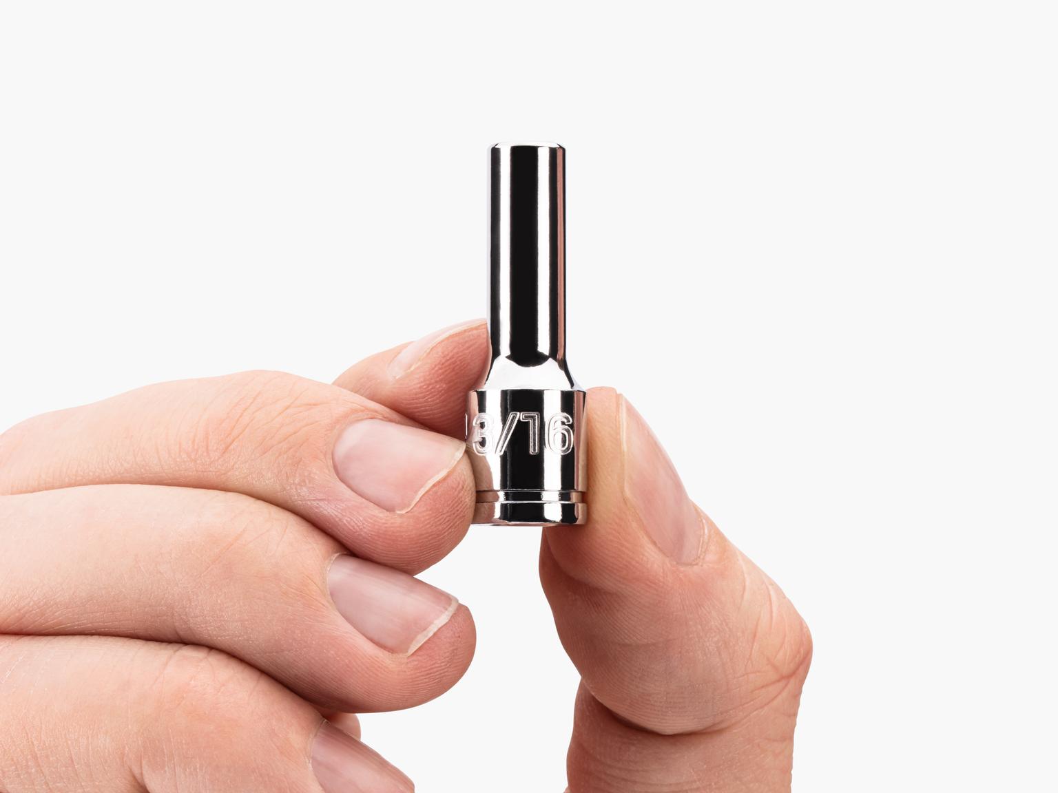 Person holding Tekton hand drive 6-point socket. Item #SHD04003