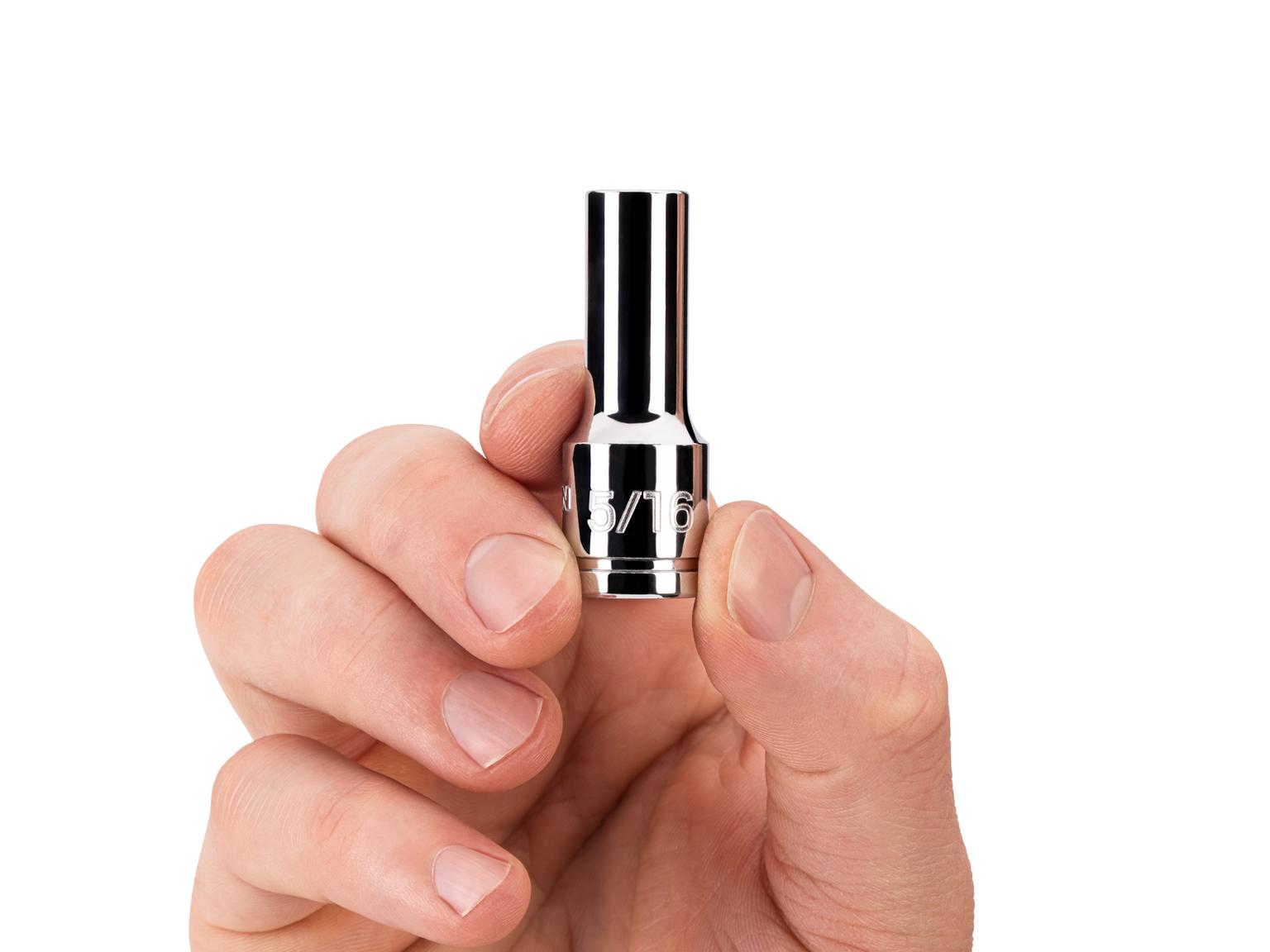 Person holding Tekton 5/16 inch hand drive 6-point socket. Item #SHD14008